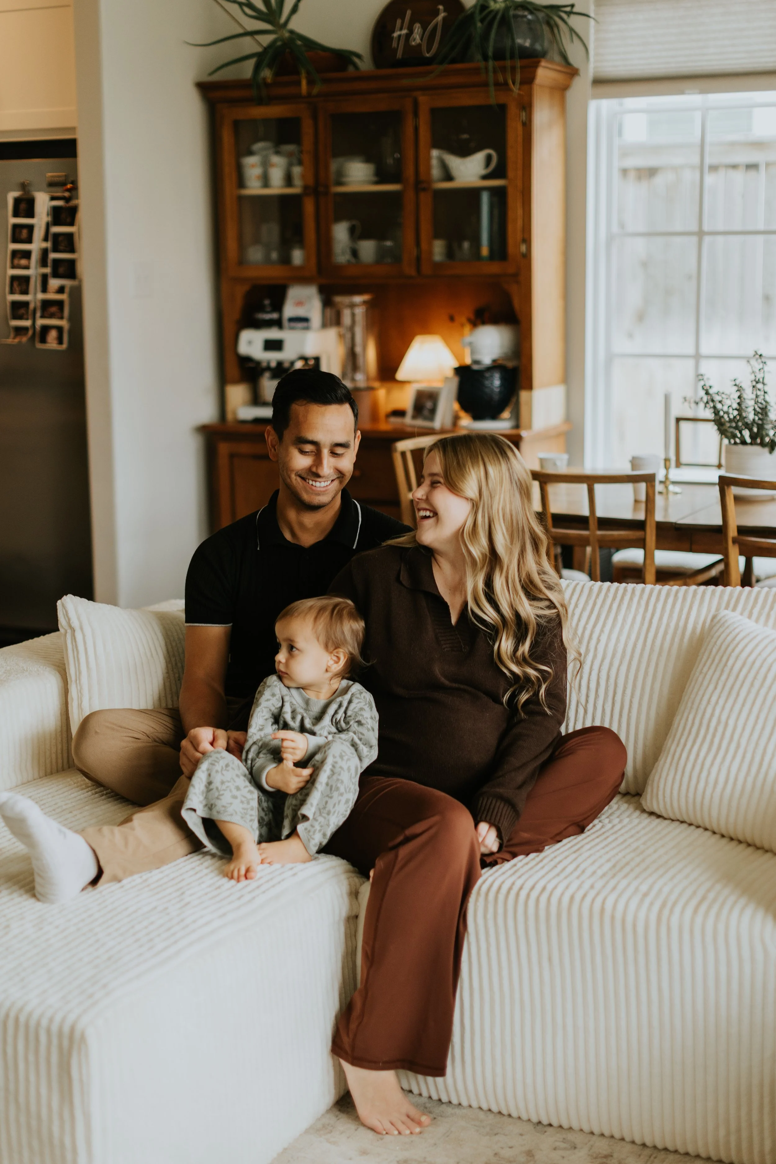 A family smiles together at their home based prenatal visit in Lubbock Texas.