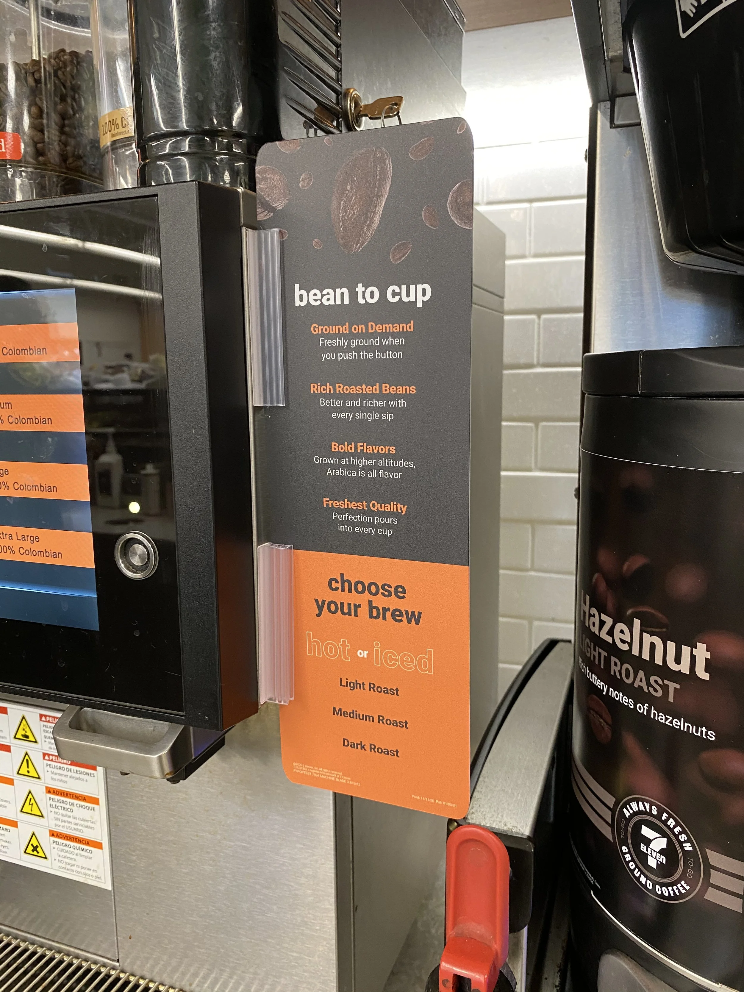 Sign overview of a coffee bean to cup process and brew options next to coffee machine.