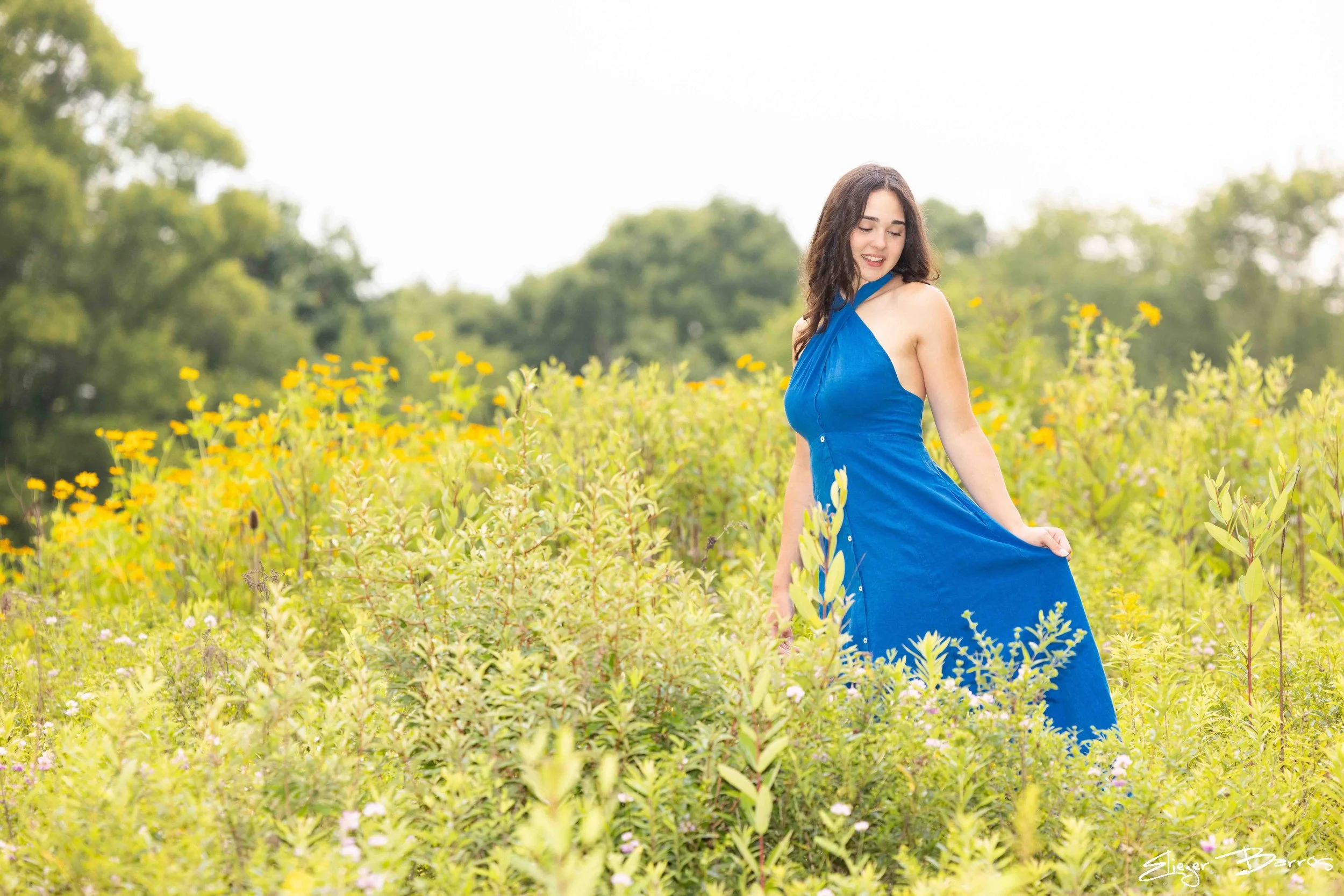 Senior pictures at Pittsburgh Botanic Garden with colorful flowers and glasshouse