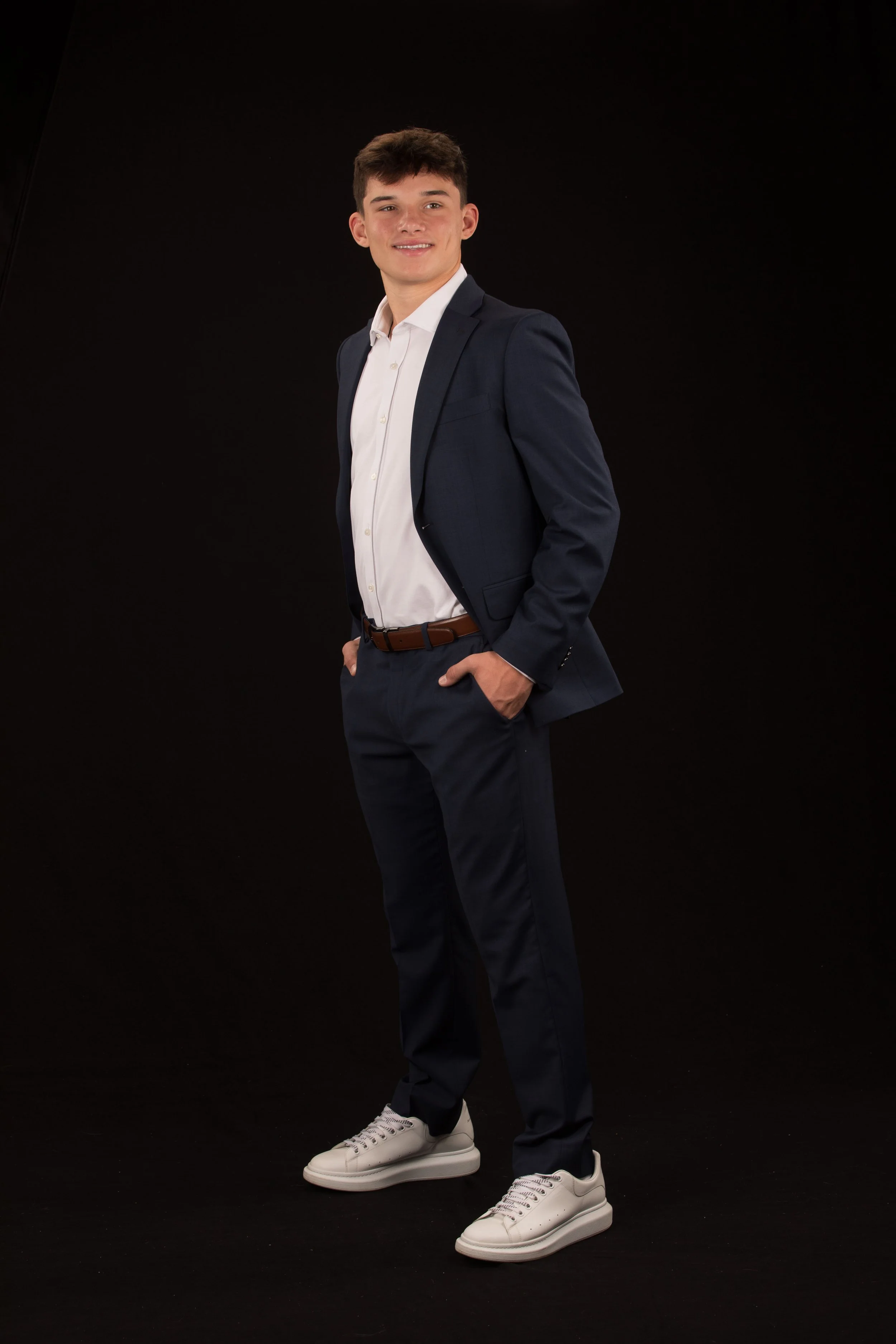 Class of 2026 Upper St. Clair senior Nico in a navy suit during his formal studio senior portraits