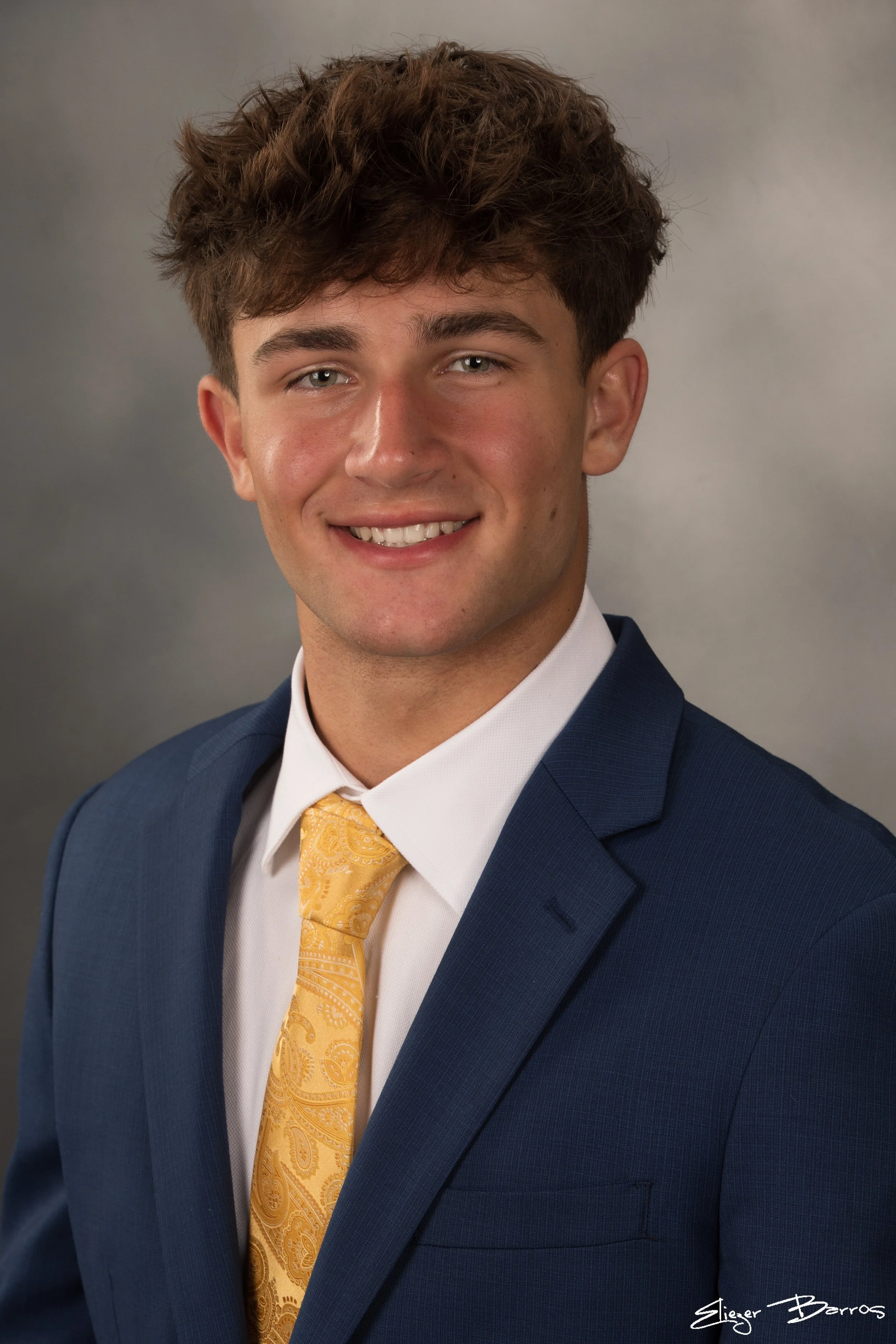 Studio senior yearbook pictures of a young man in suit Pittsburgh