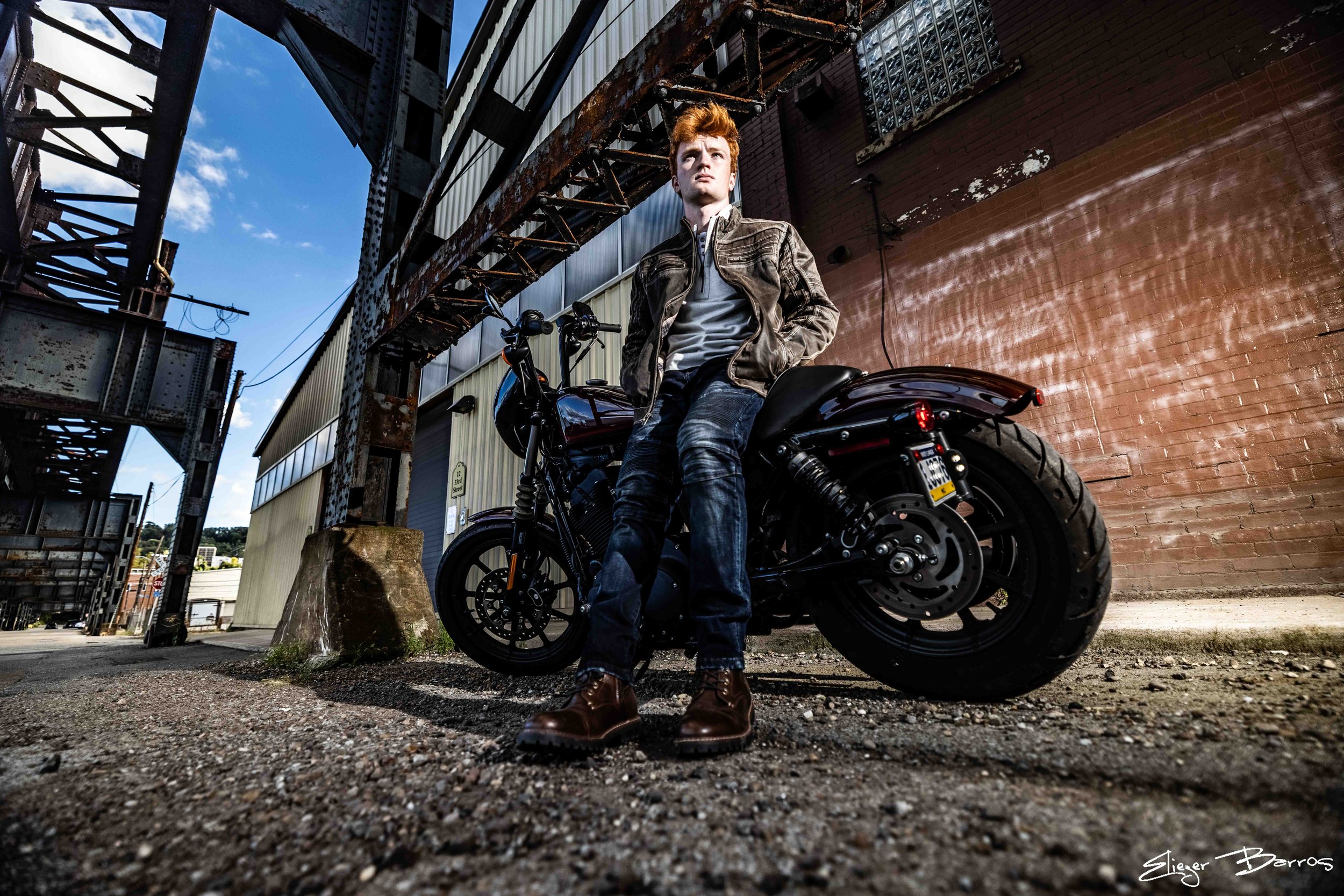Urban senior pictures in Pittsburgh Strip District with warehouses and city energy