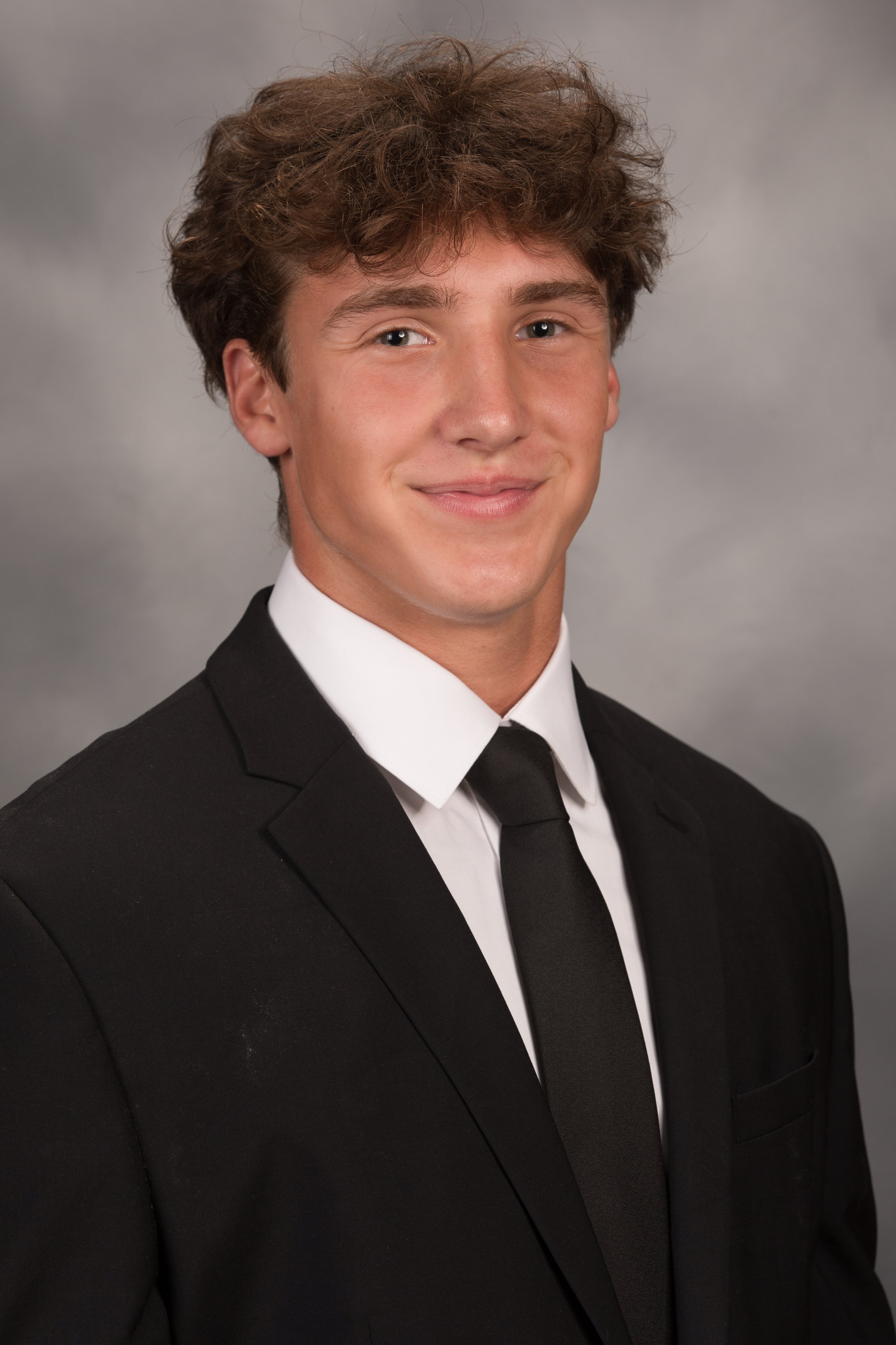 Studio senior yearbook pictures of a young man in suit Mt. Lebanon