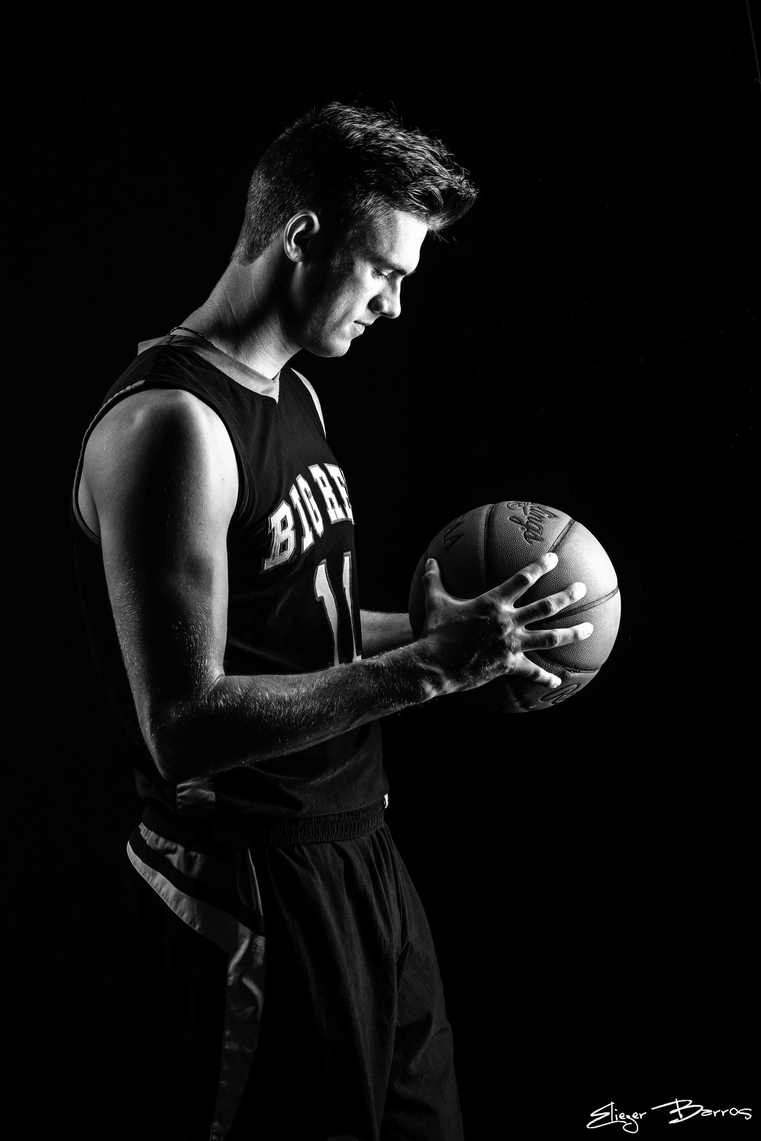 Senior pictures of a basketball player in dramatic studio lighting in Pittsburgh
