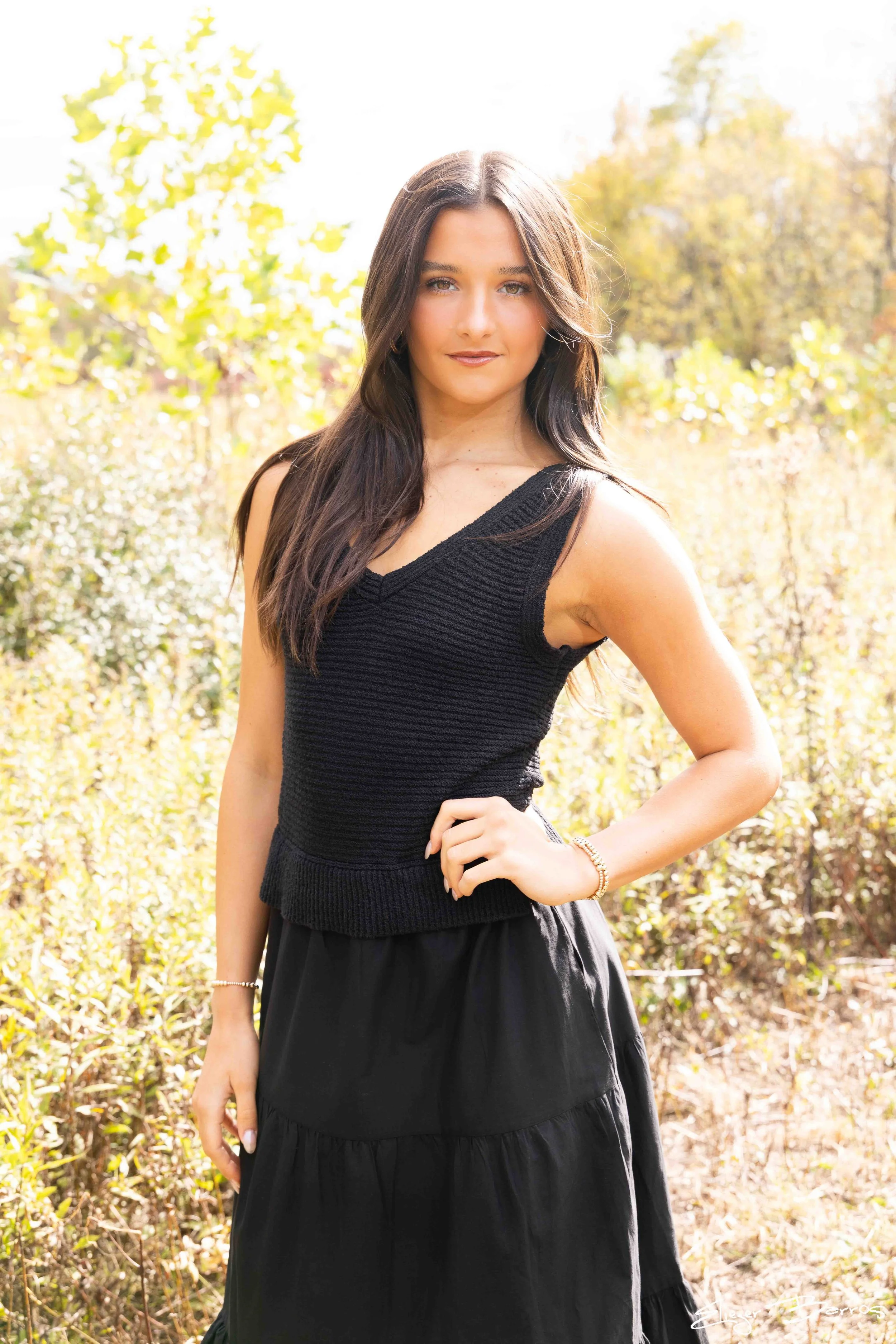 Class of 2026 senior Gianna posing in a black outfit outdoors at Pittsburgh Botanic Garden during her fall senior session