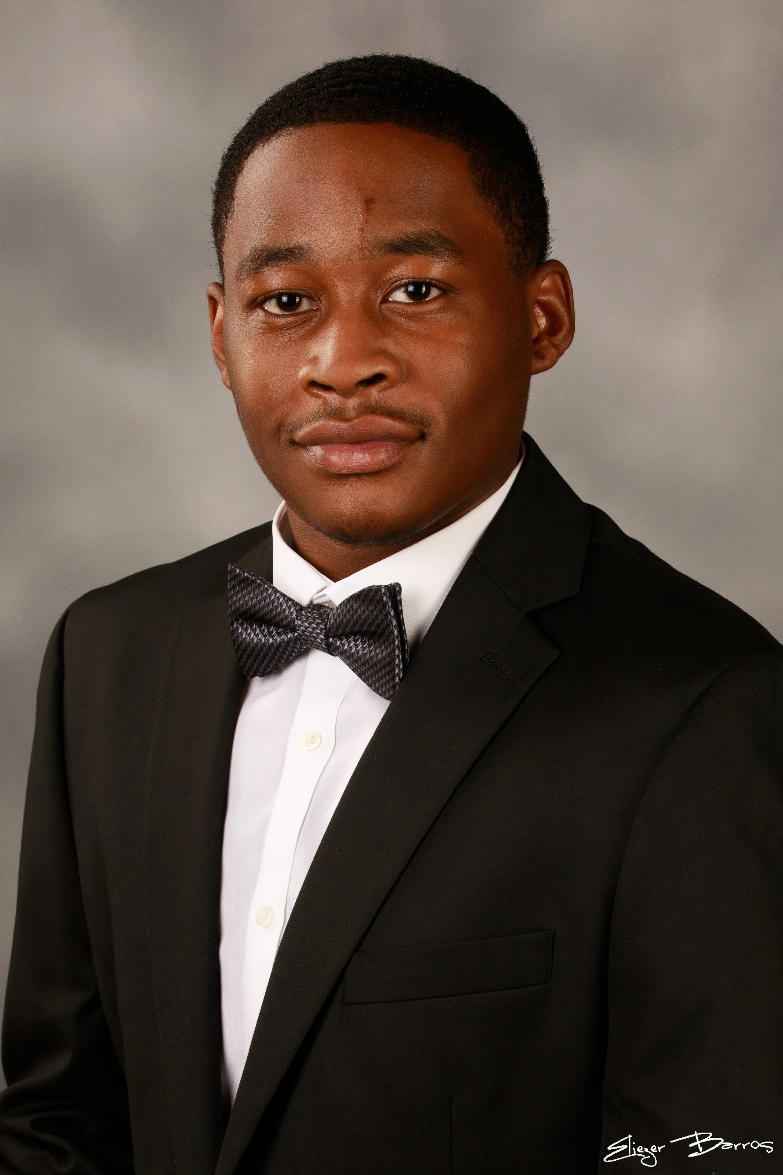 Studio senior yearbook pictures of a young man in suit from Mt. Lebanon