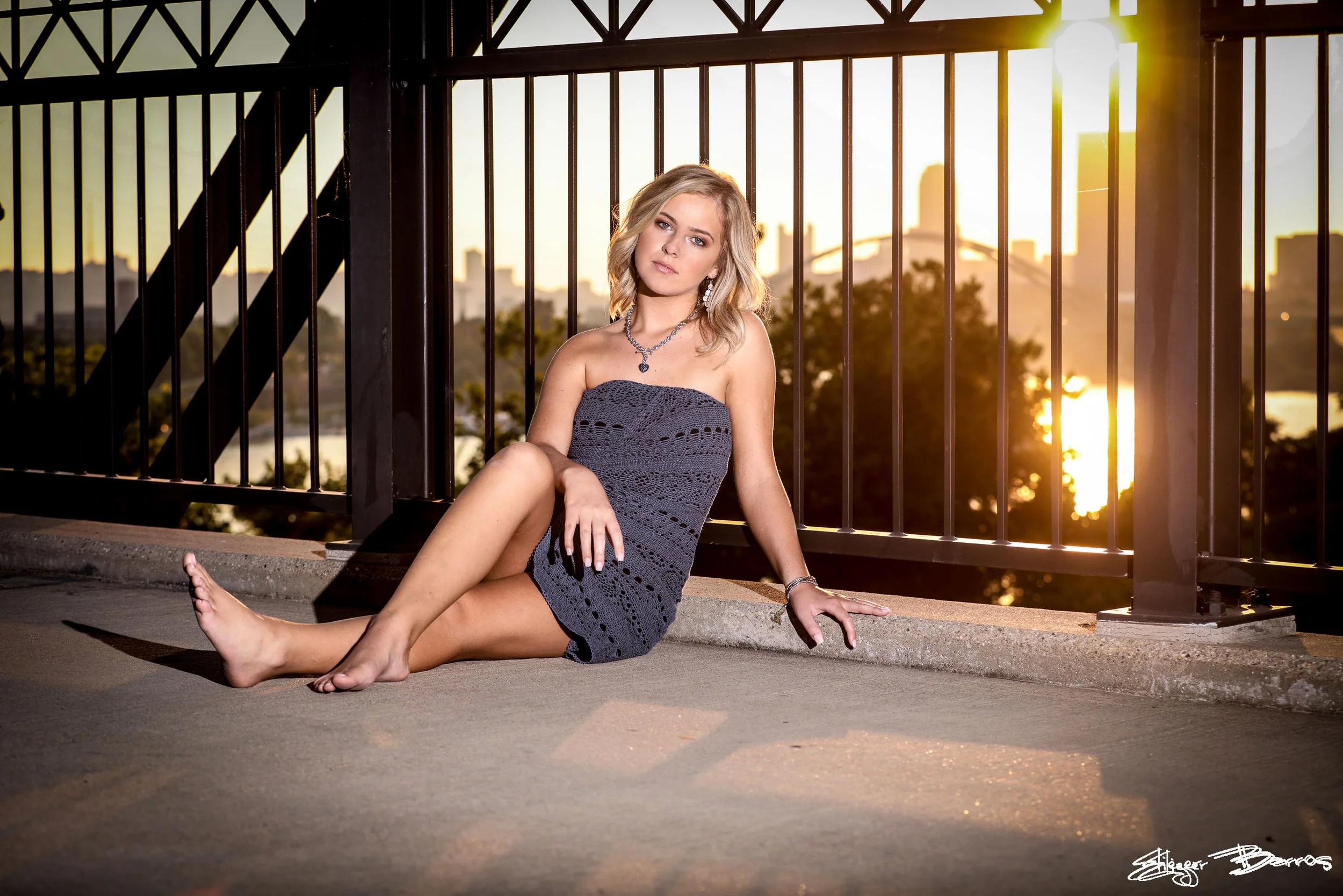 Senior pictures on Hot Metal Bridge in Pittsburgh South Side with river and city skyline