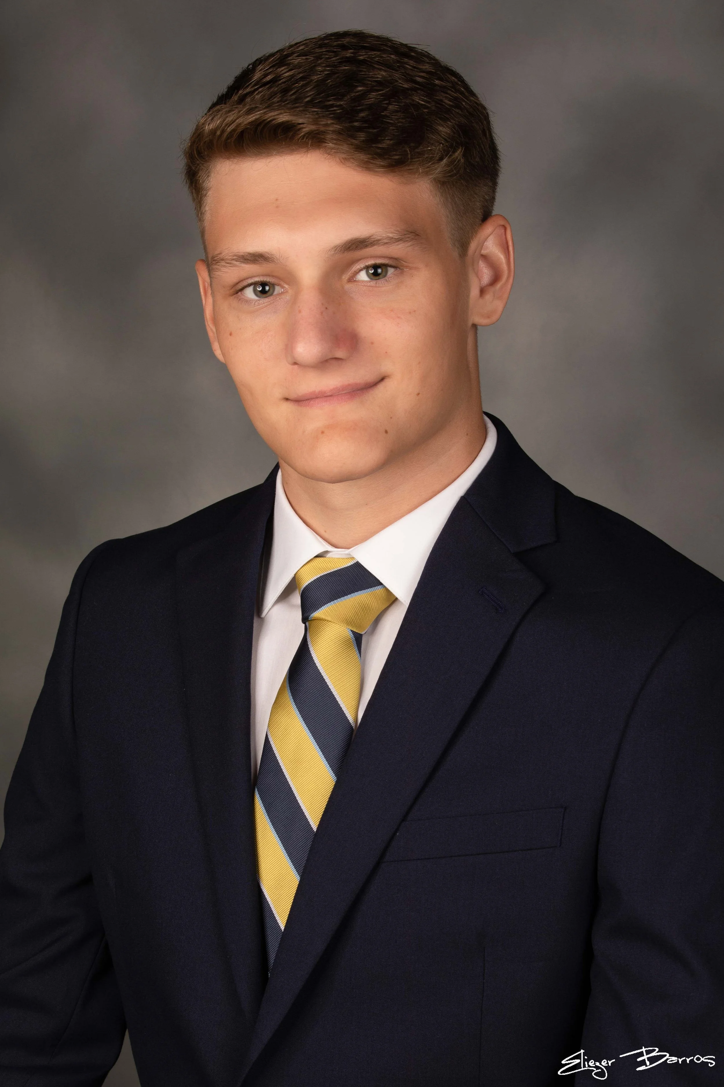 Studio senior yearbook pictures of a young man in suit Mt. Lebanon