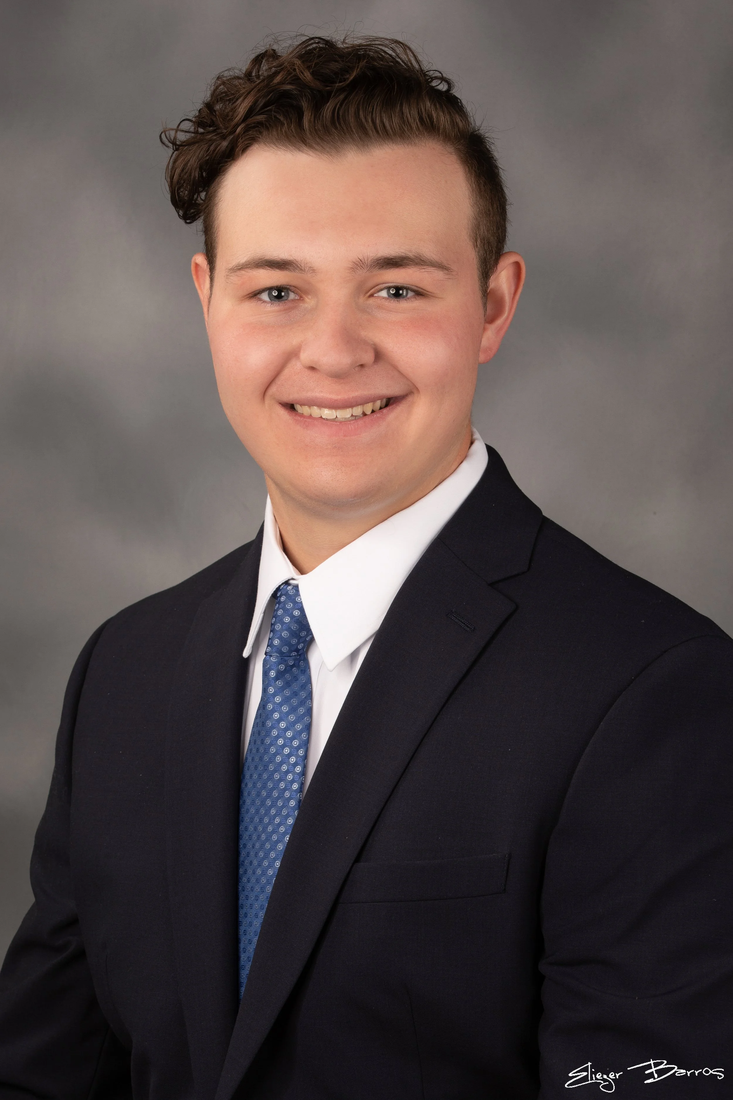 Studio senior yearbook pictures of a young man in suit from Mt. Lebanon