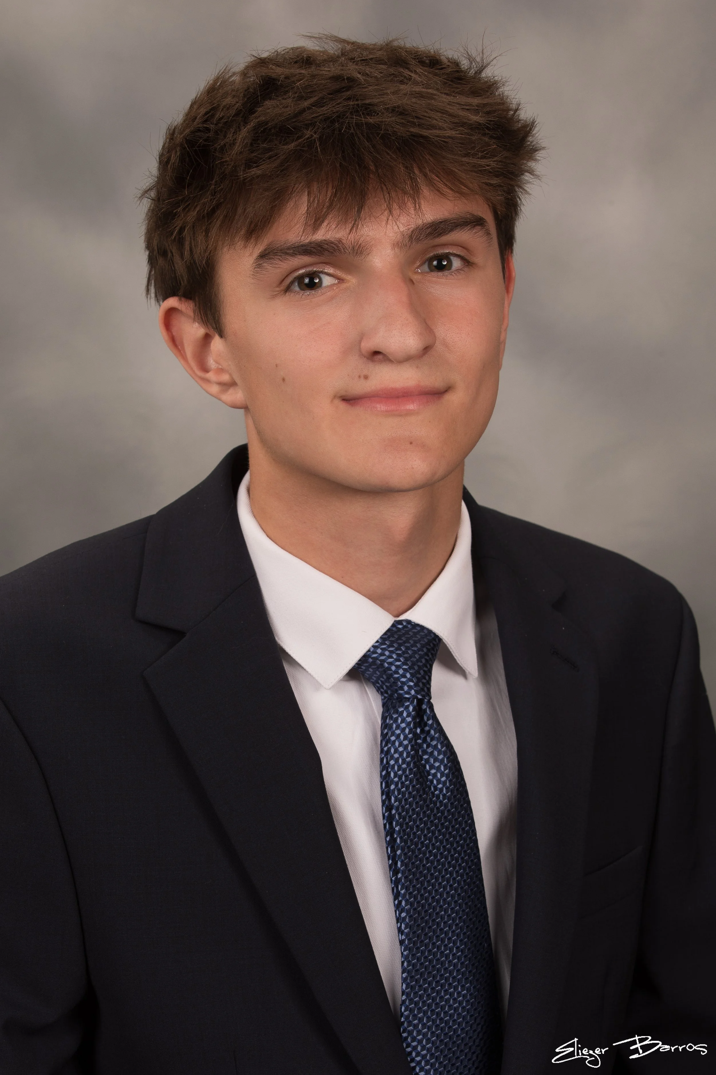 Studio senior yearbook pictures of a young man in suit Pittsburgh
