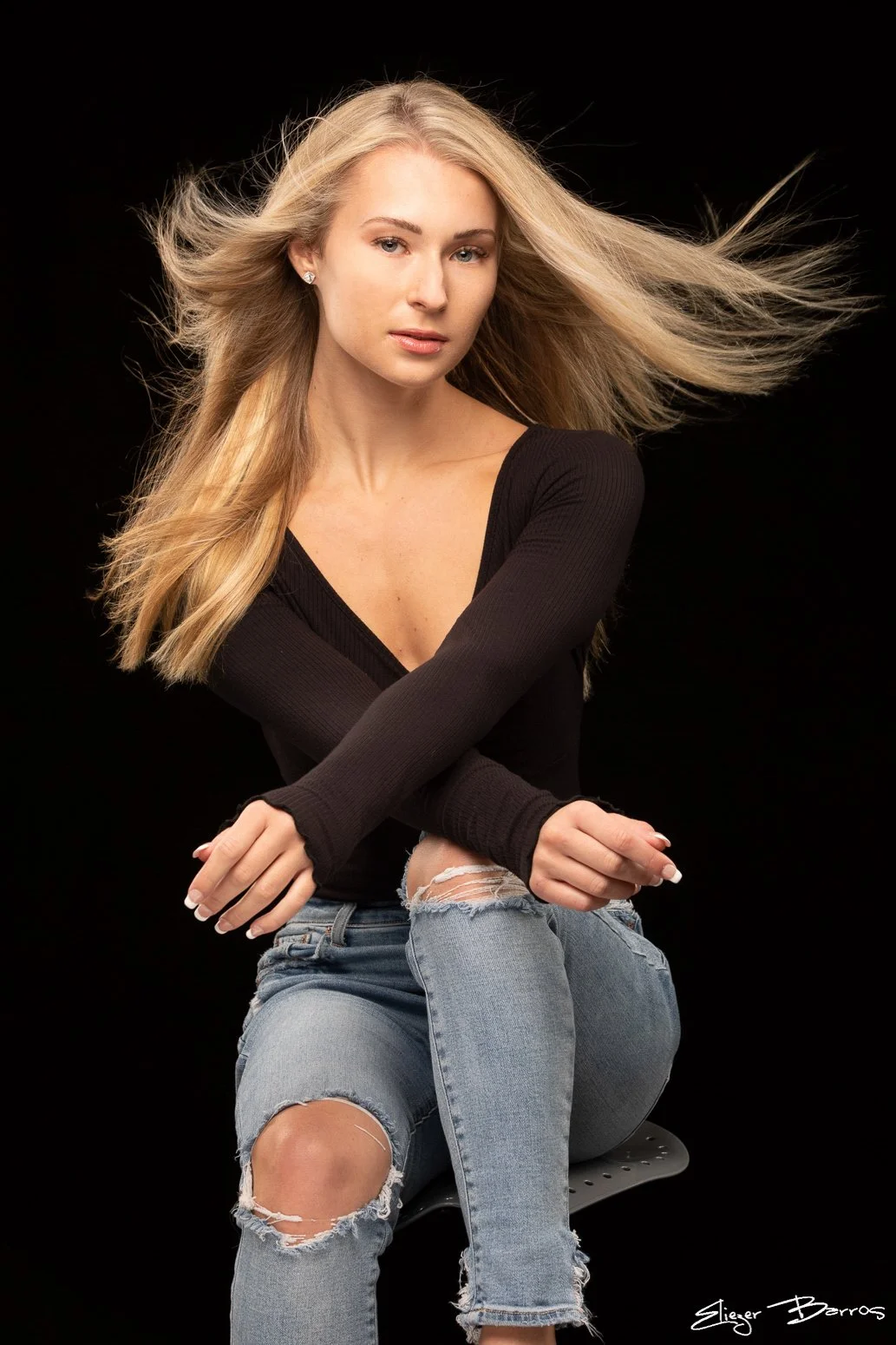 Studio senior pictures of a young woman with dynamic hair and artistic lighting in Pittsburgh