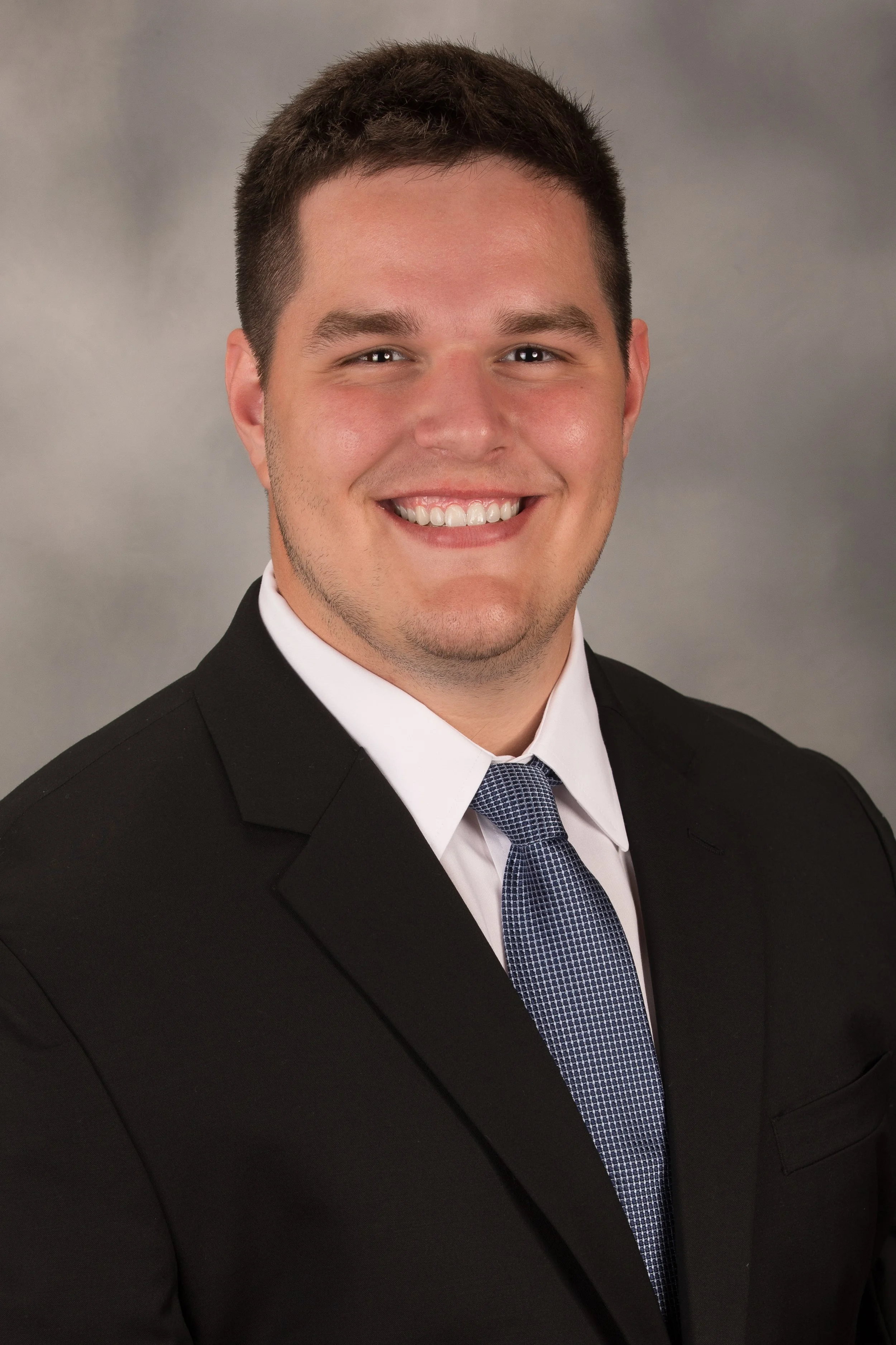 Studio senior yearbook pictures of a young man in suit Pittsburgh