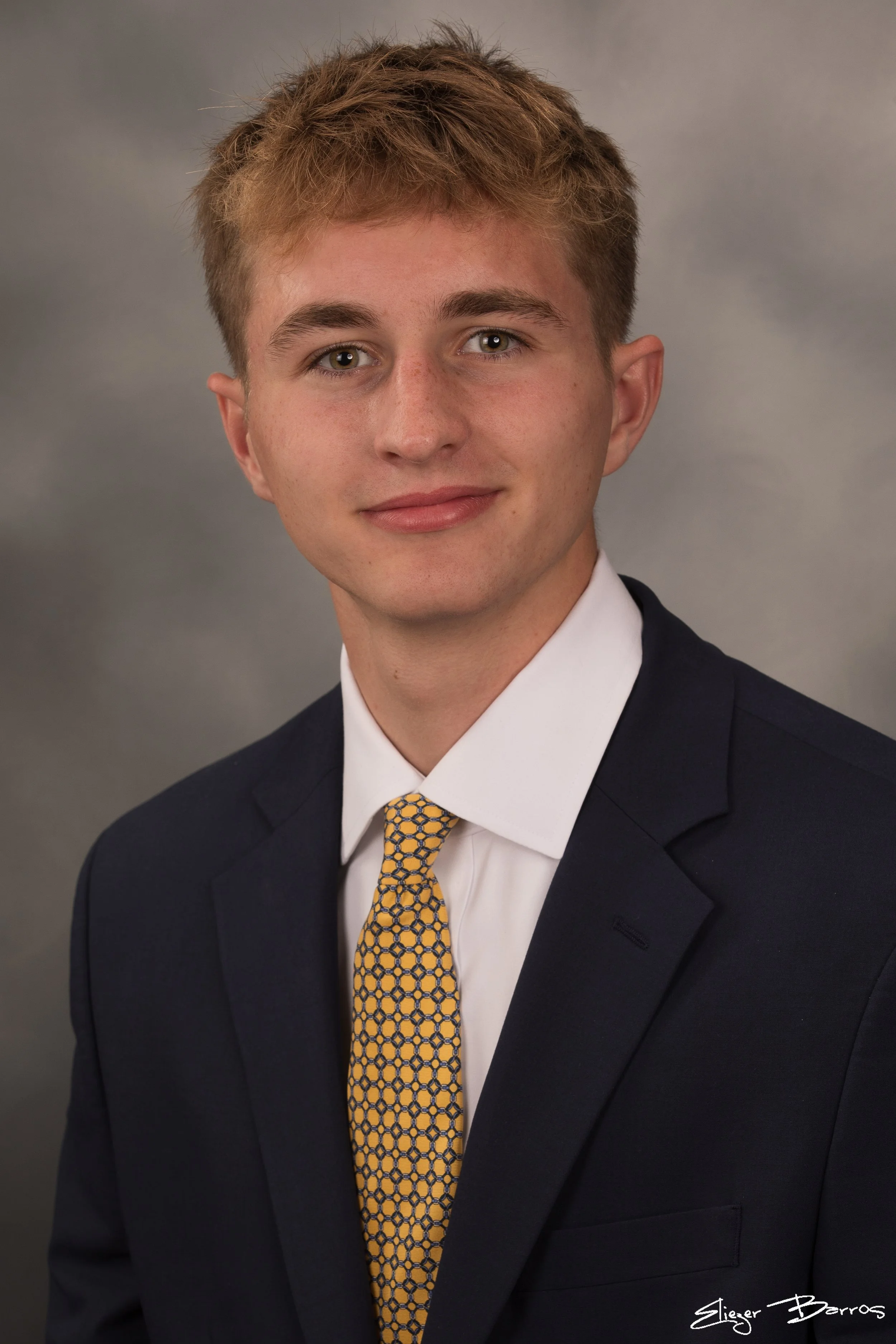 Studio senior yearbook pictures of a young man in suit Pittsburgh
