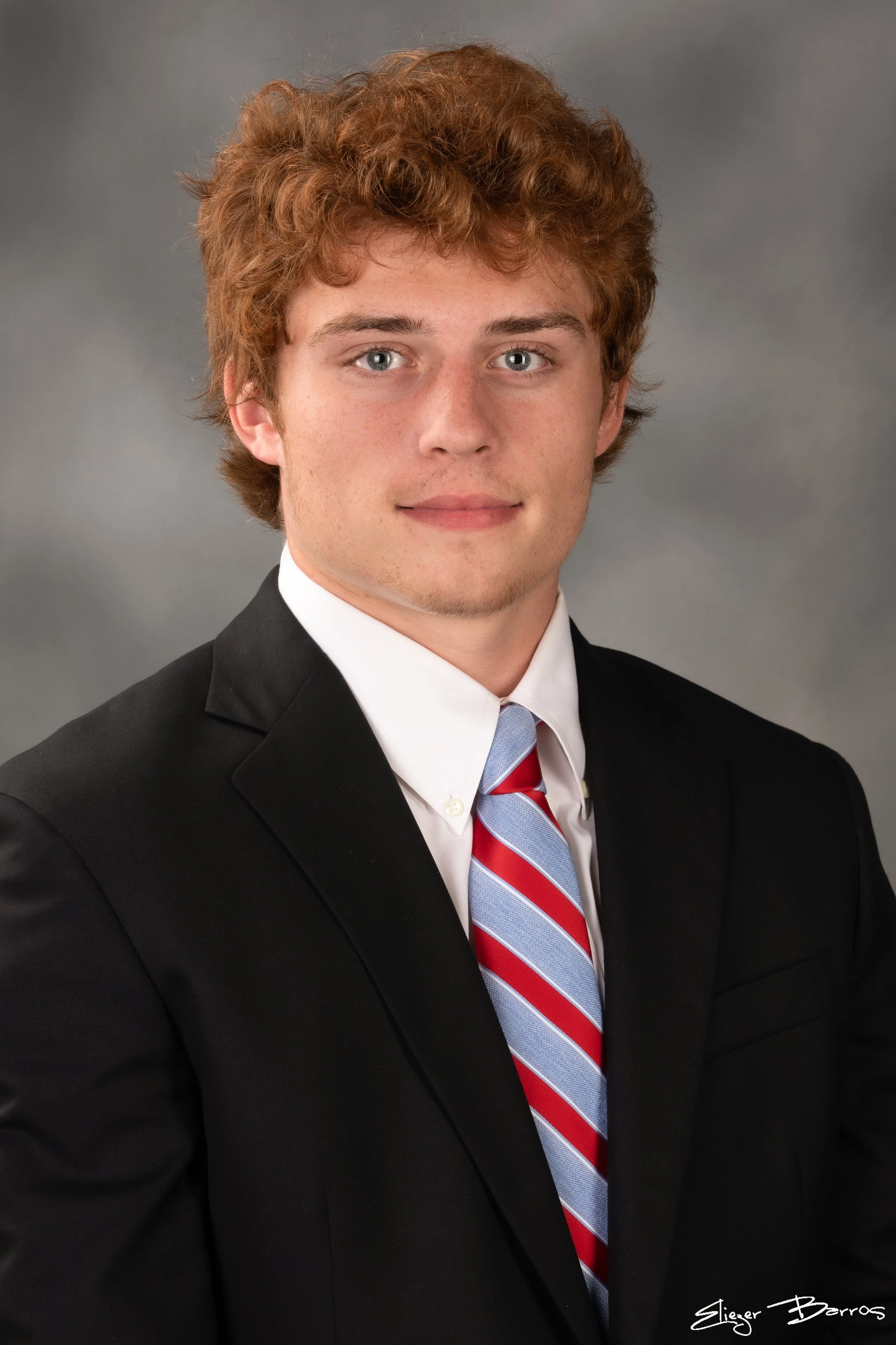 Studio senior yearbook pictures of a young man in suit from Mt. Lebanon