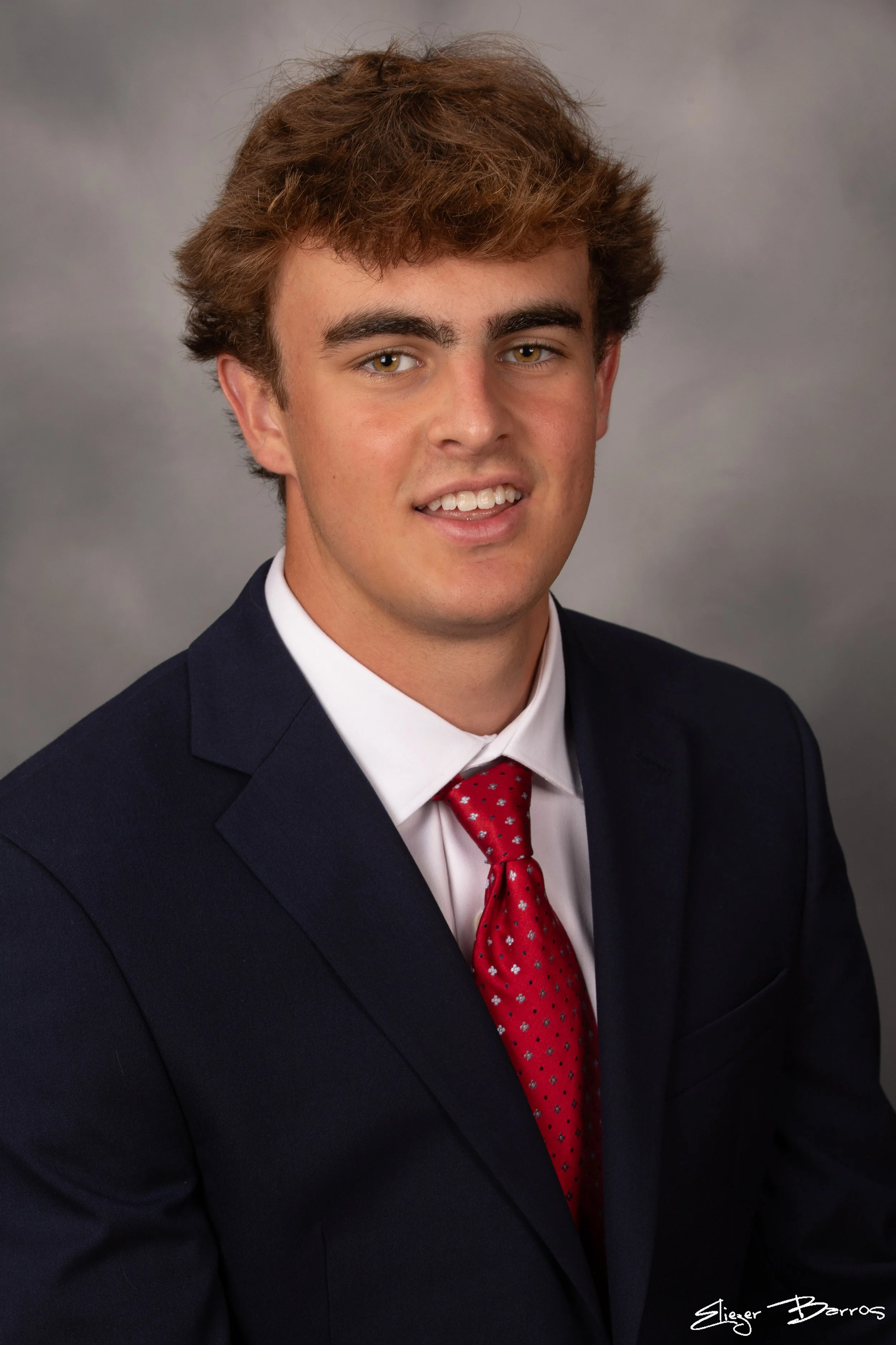 Studio senior yearbook pictures of a young man in suit Pittsburgh