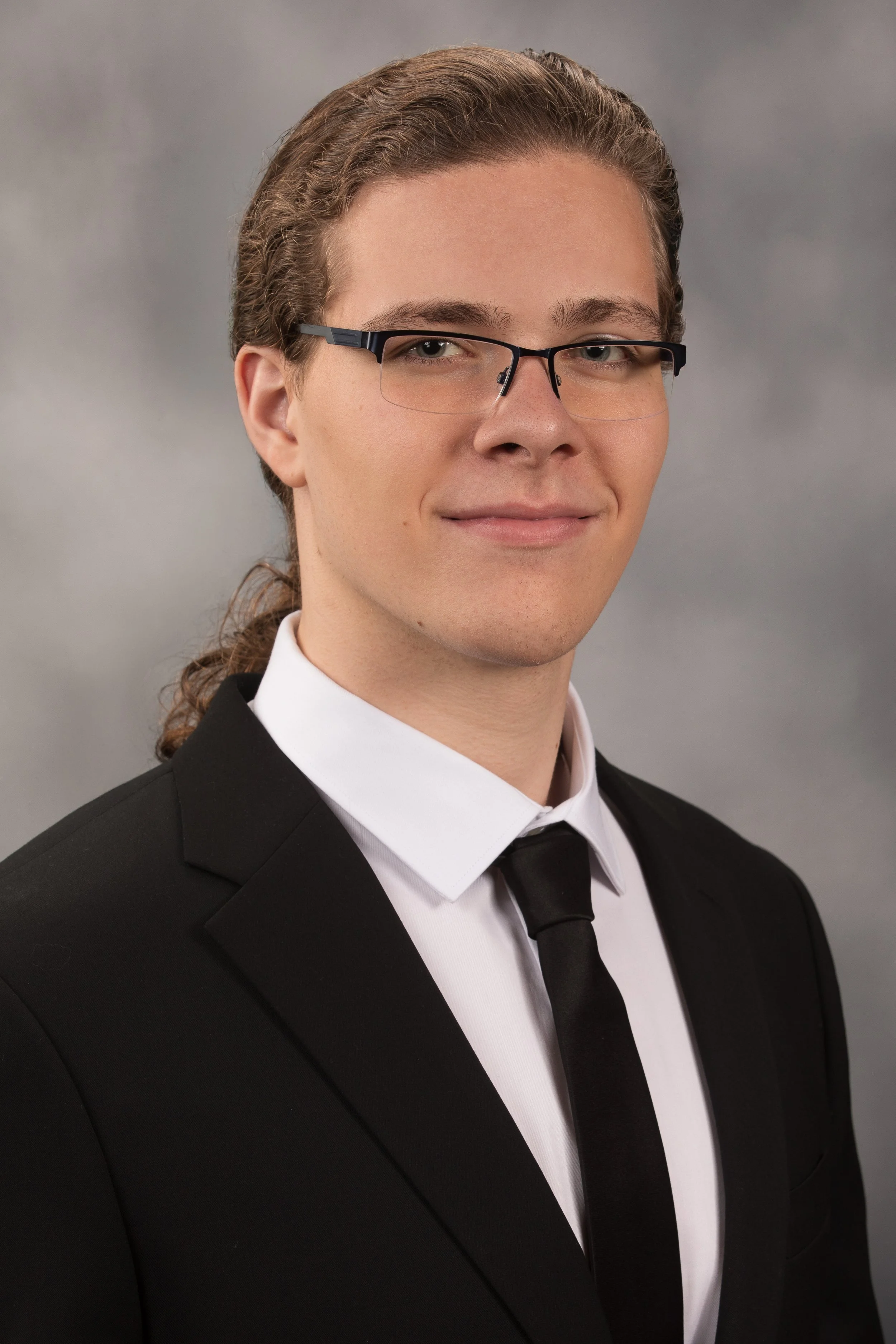 Studio senior yearbook pictures of a young man in suit Pittsburgh