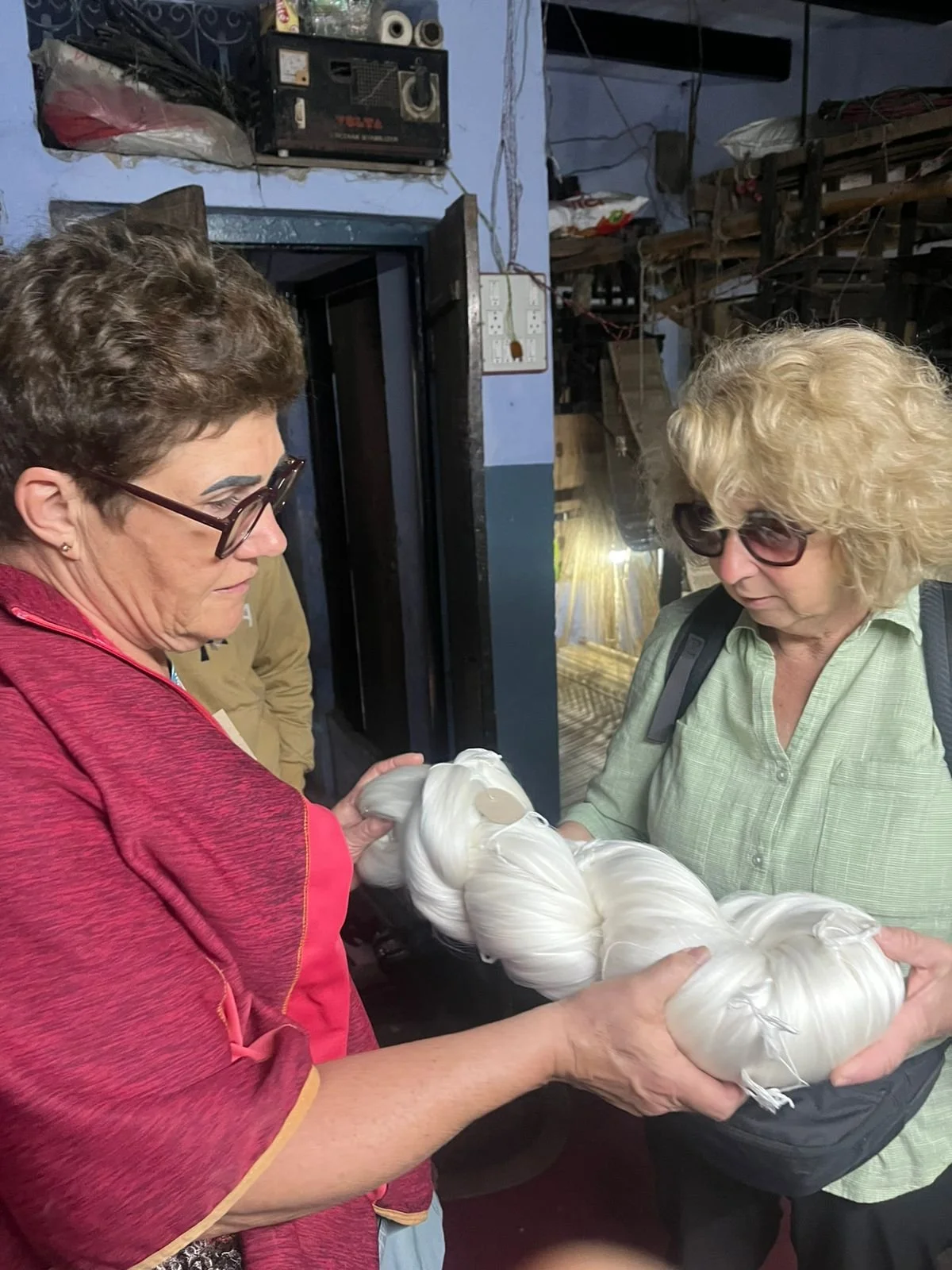 Guest getting a touch and feel of silk types