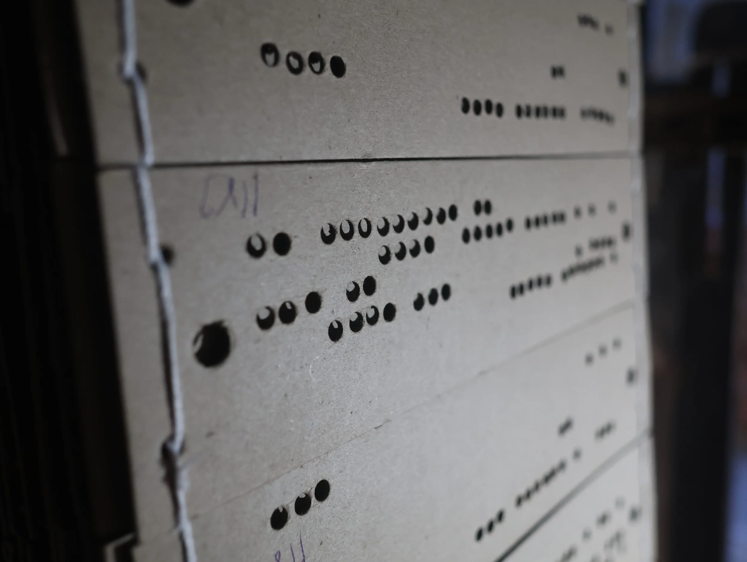 A close up shot of Punchcards on a handloom