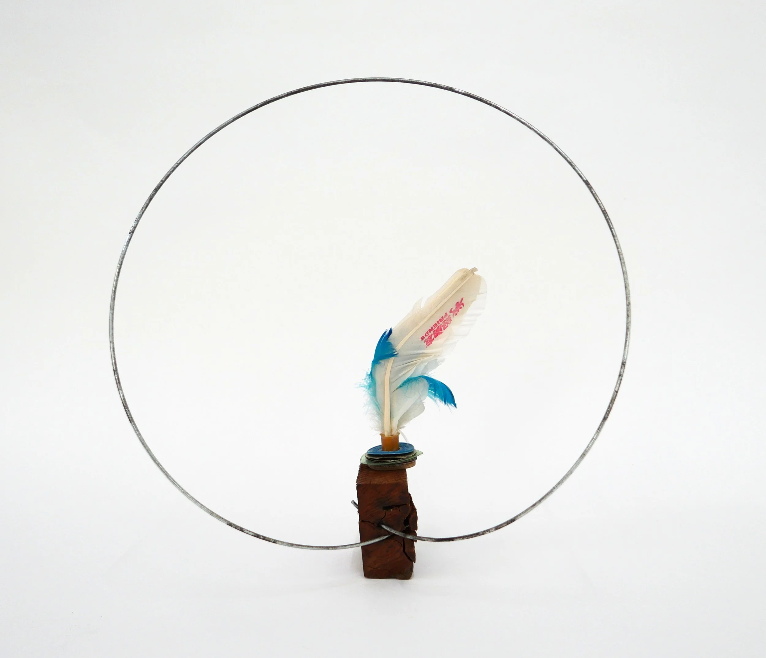 Proposal Nr. 36, 2022, metal wire, wood, feather toy