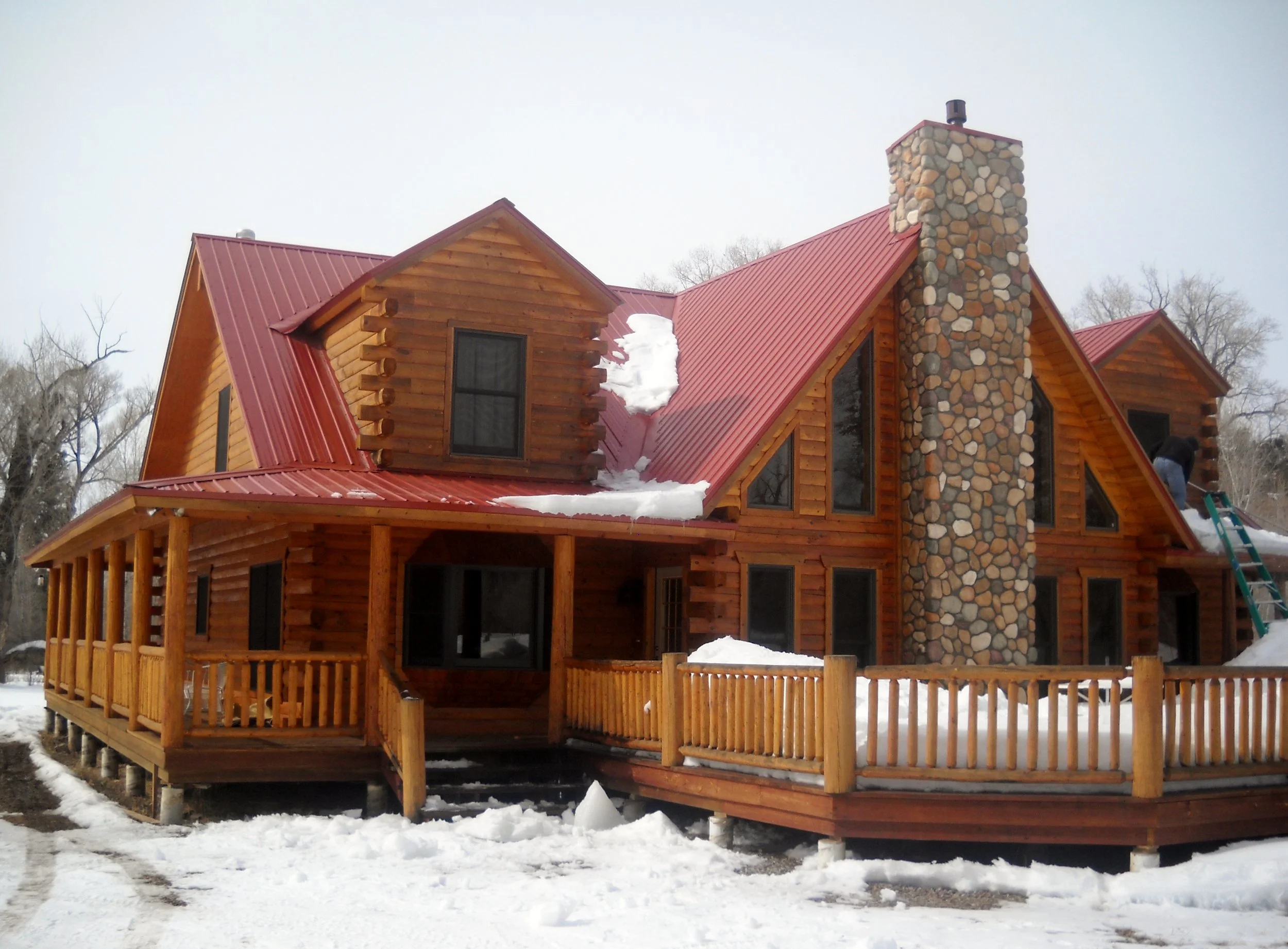 Log home with red roof
