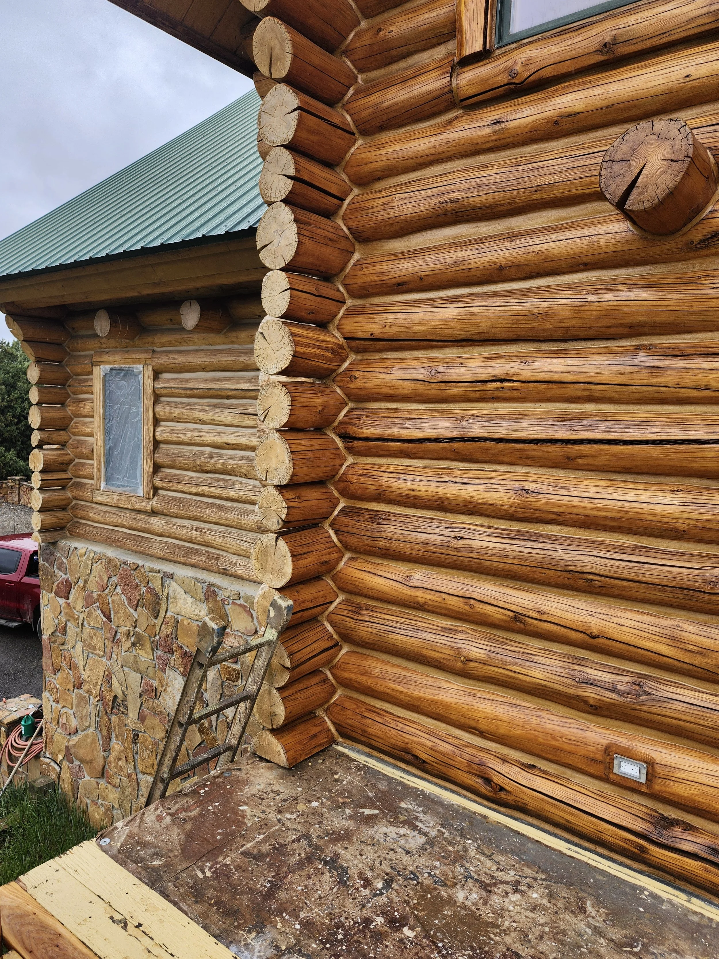 Front door area with new stain and a section with old stain