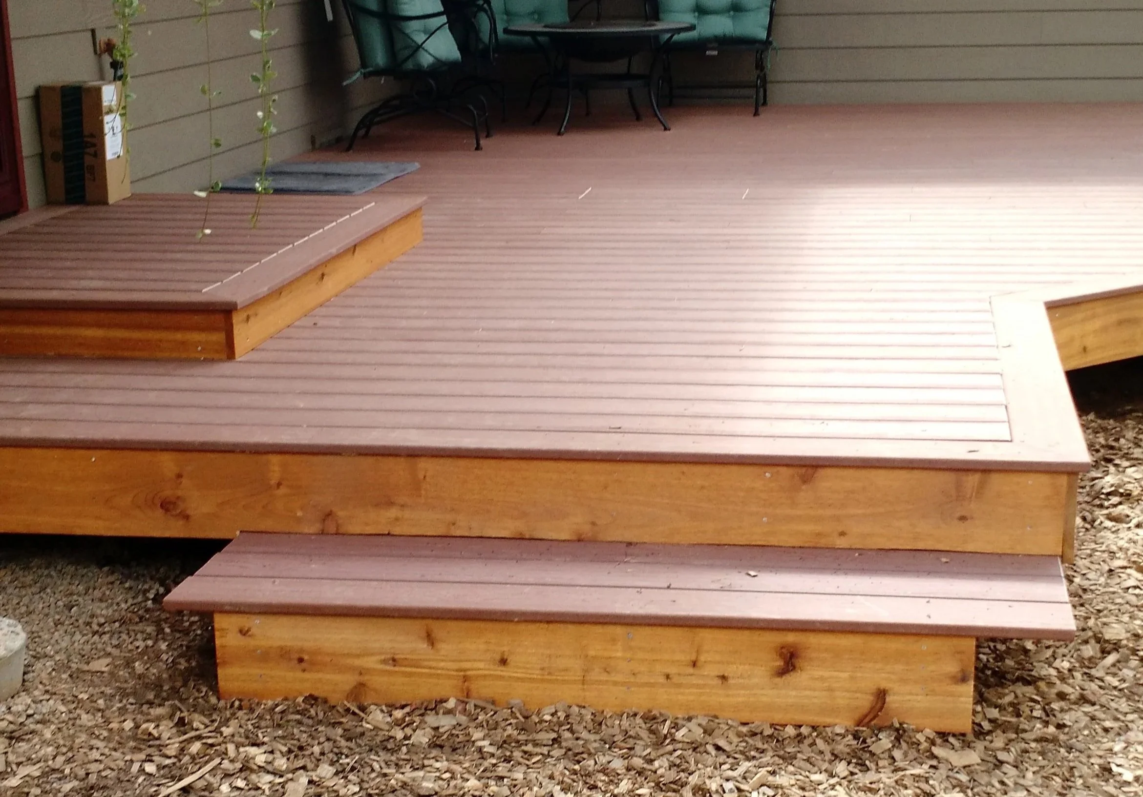 Remodeled brown deck with steps