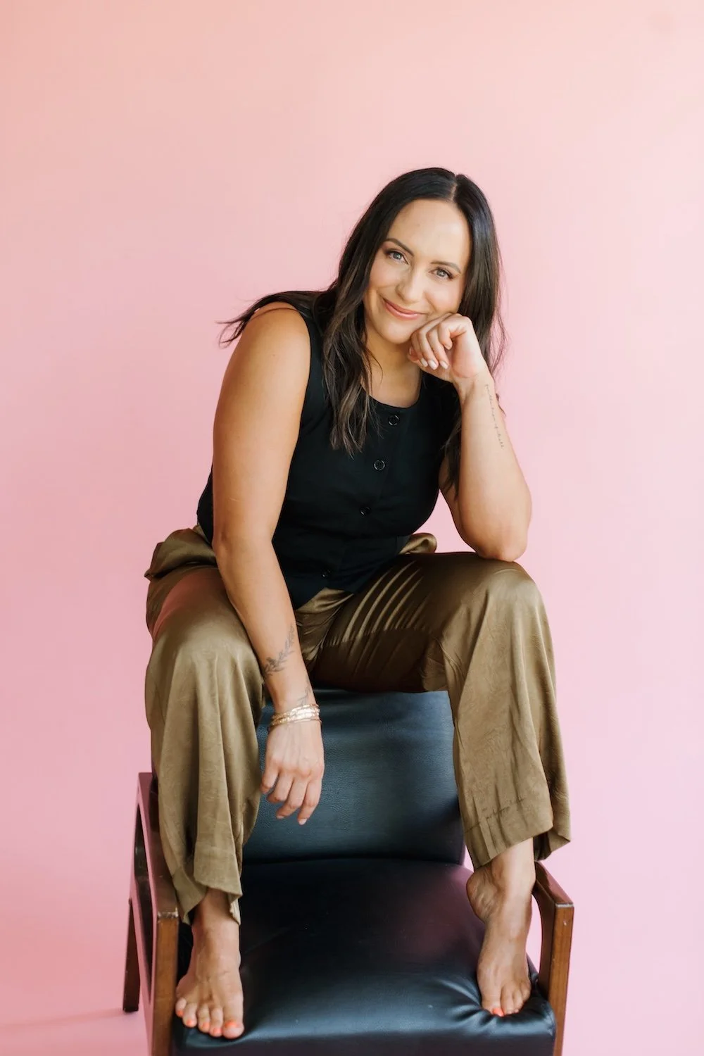 Portrait of Cass sitting on a chair