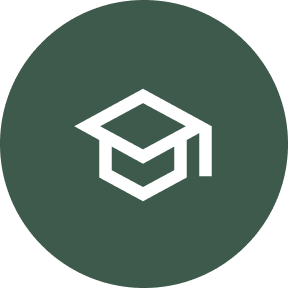 circle with a green background with a white graduation cap in the center