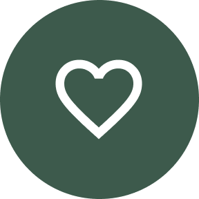 circle with a green background with a white heart in the center