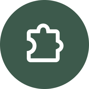 circle with a green background with a white puzzle piece in the center