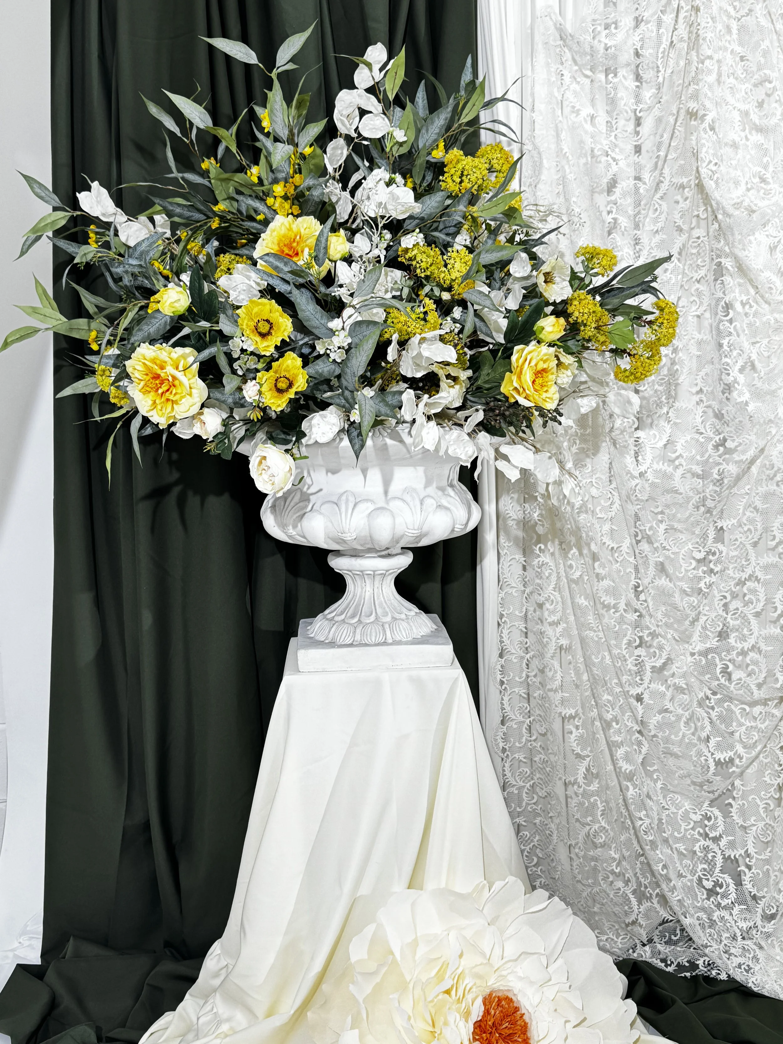 Yellow garden style wedding floral urn