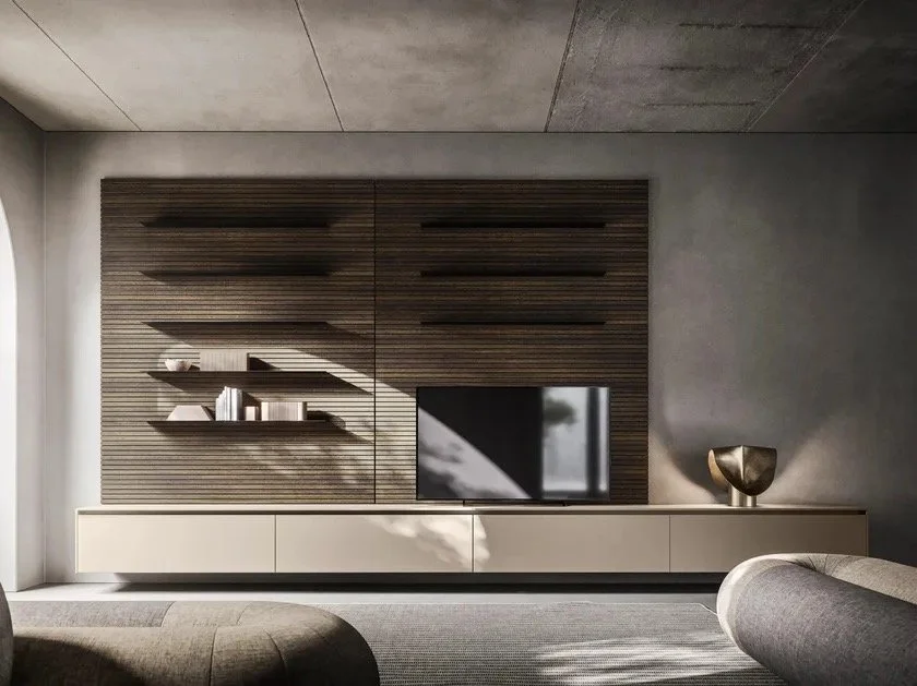 Salon moderne Pedini avec bibliothèque en bois sombre, meuble TV blanc, décoration minimaliste et canapé en tissu gris.