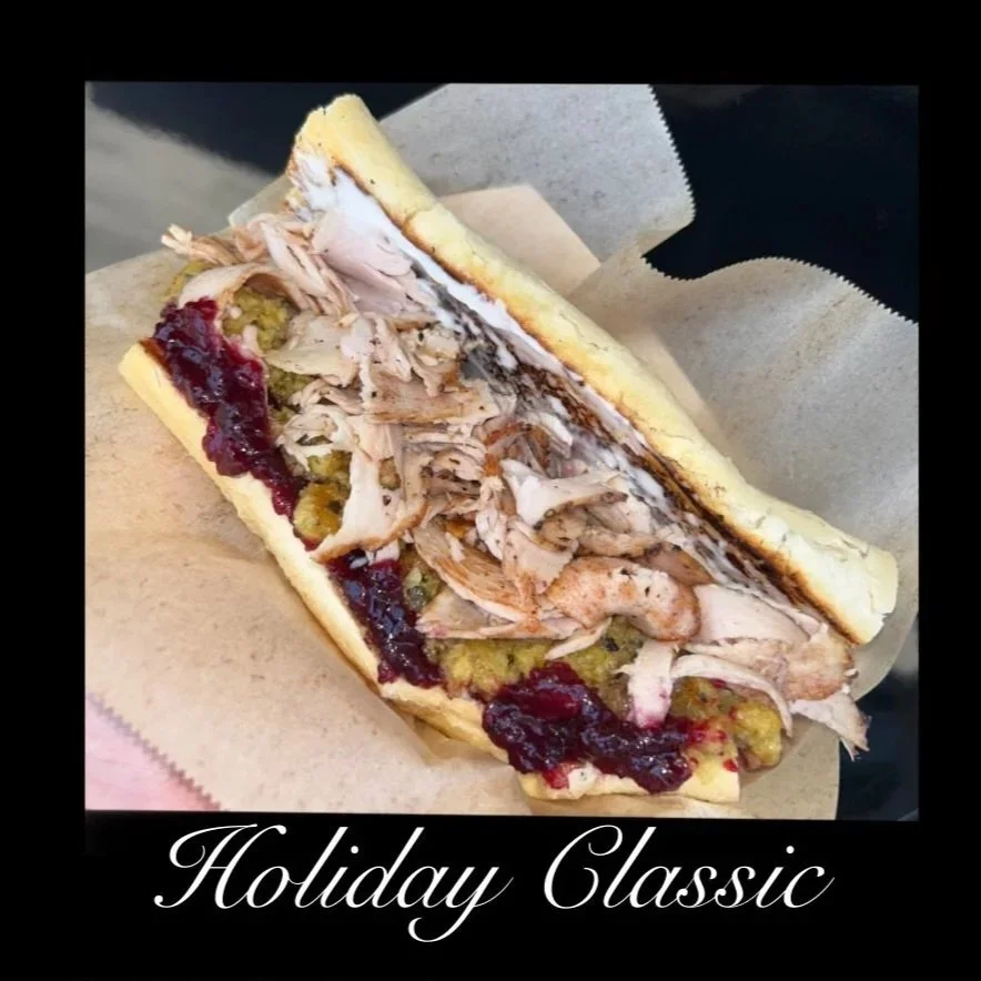 A sandwich with shredded turkey, cranberry sauce, stuffing, and gravy in a hoagie bun, labeled 'Holiday Classic'.