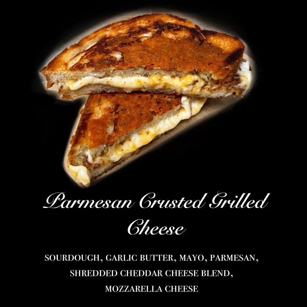 Image of a grilled cheese sandwich with melted cheese and toasted bread on a black background. Text overlay describes it as Parmesan Crusted Grilled Cheese with sourdough, garlic butter, mayo, parmesan, shredded cheddar, and mozzarella cheese.