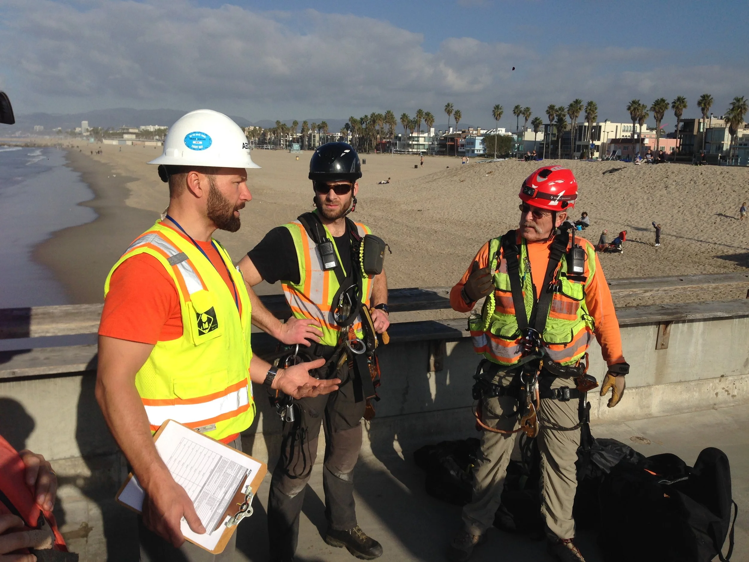 SPRAT-certified rope-access inspectors at Venice Pier, Venice CA — structural condition assessment