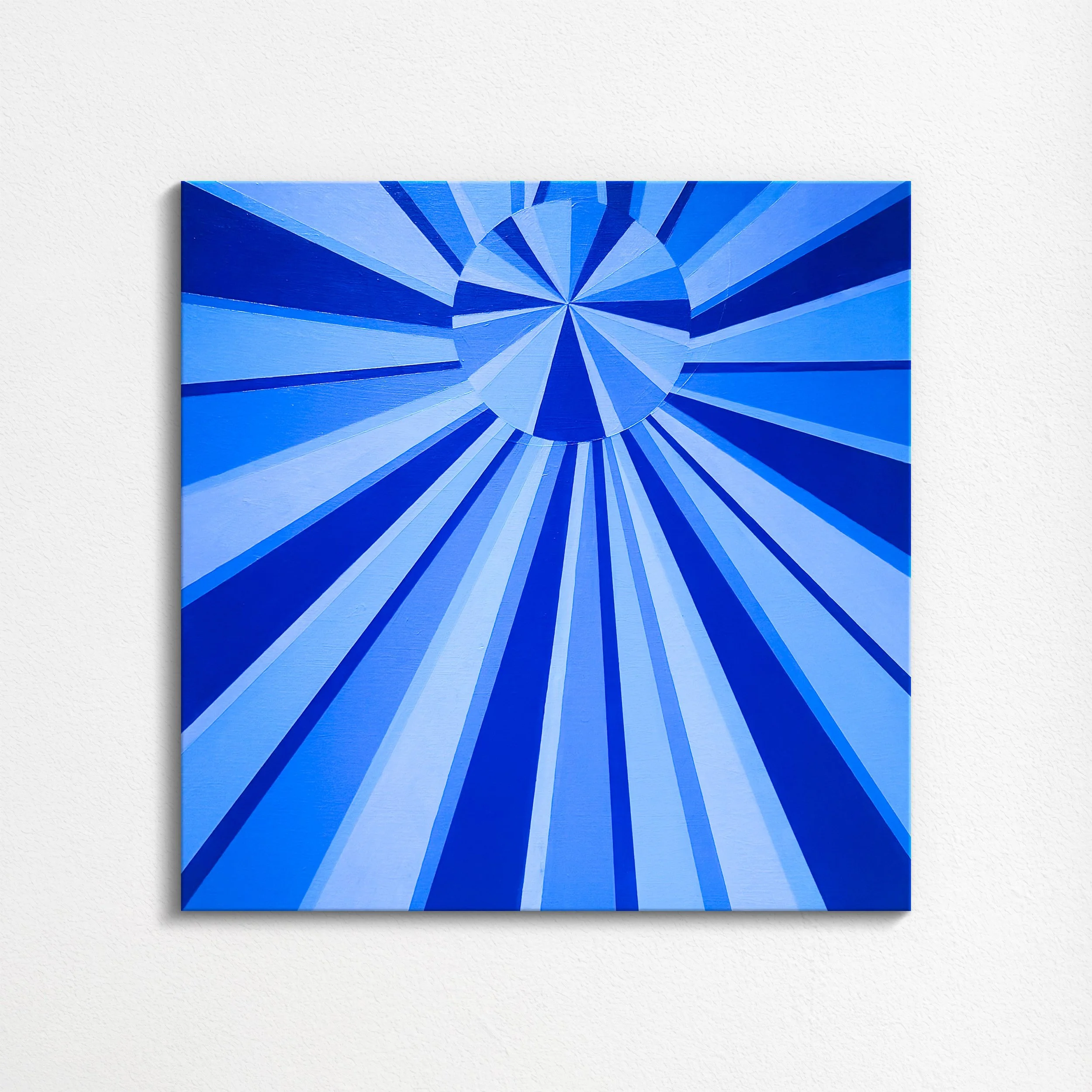 Blue geometric abstract art on canvas with radiant lines and a circular pattern at the center