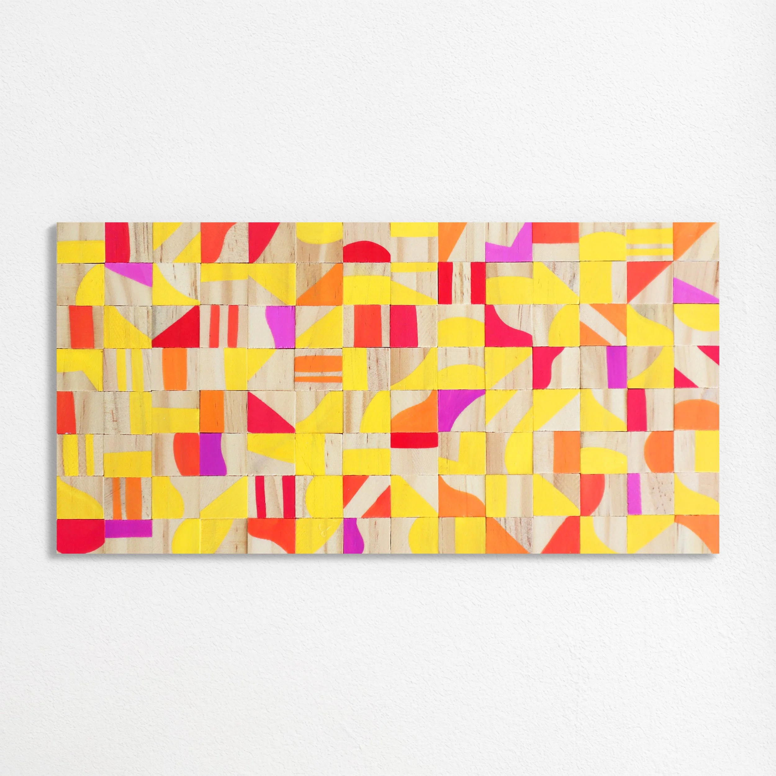 Colorful abstract geometric artwork composed of small wooden blocks painted with bright colors and patterns.