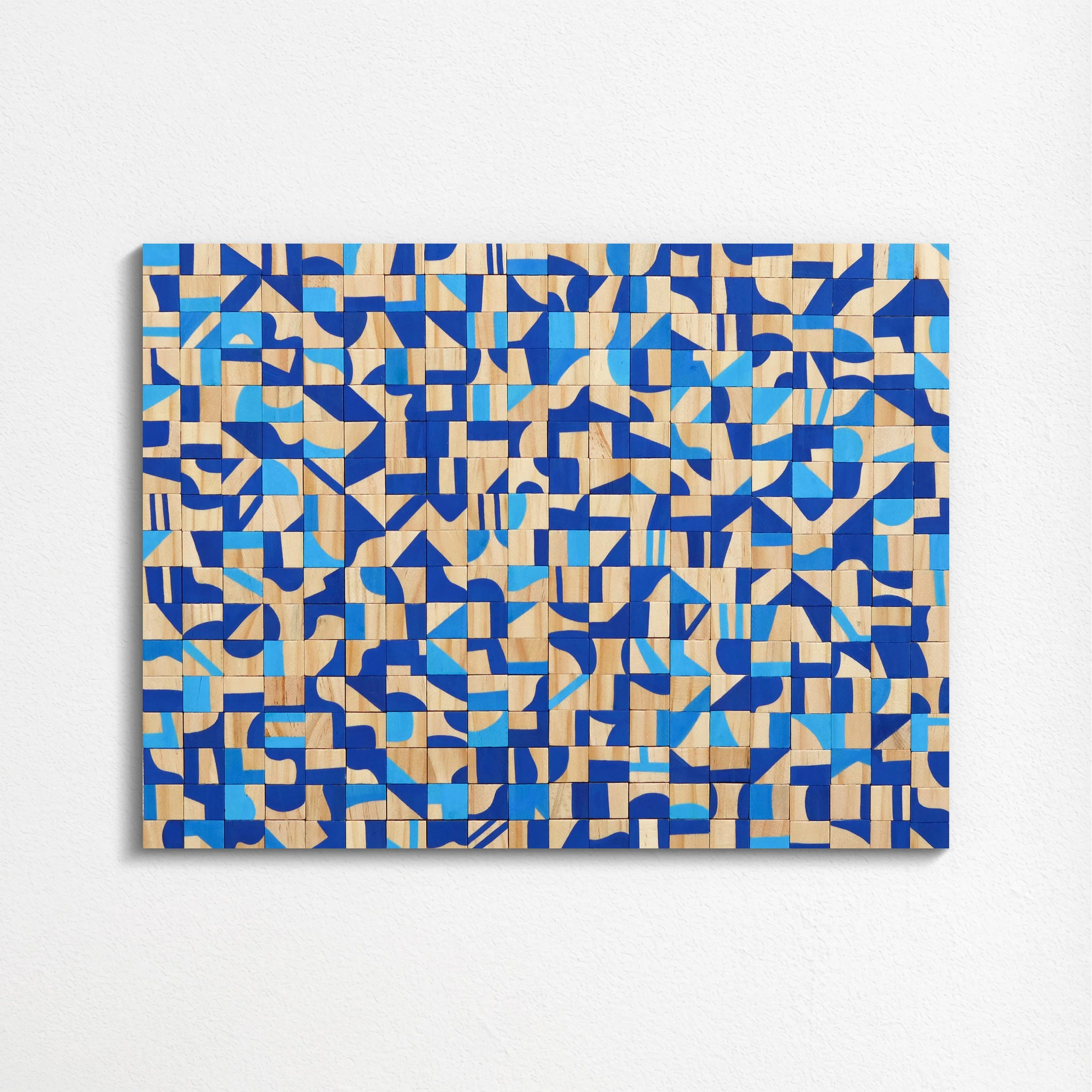 Wooden tiles painted with blue abstract geometric patterns arranged in a grid.