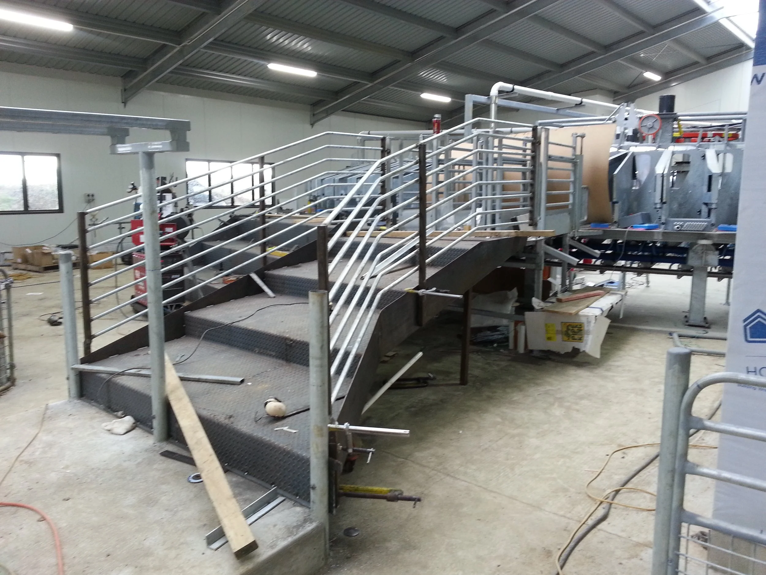 a fabricated staircase with new railings looking up the stairs