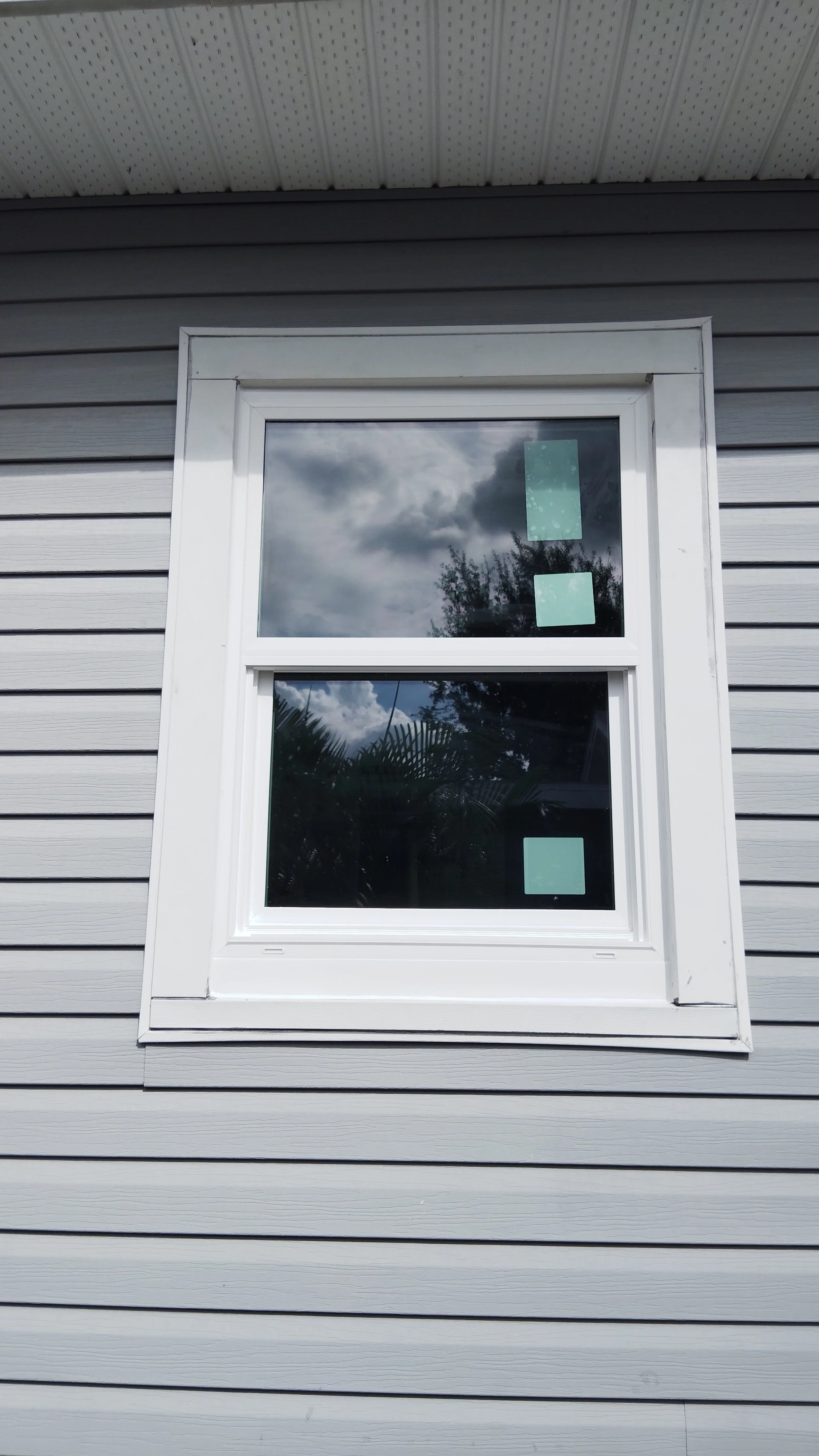 Single exterior window installed with tight trim and proper siding integration