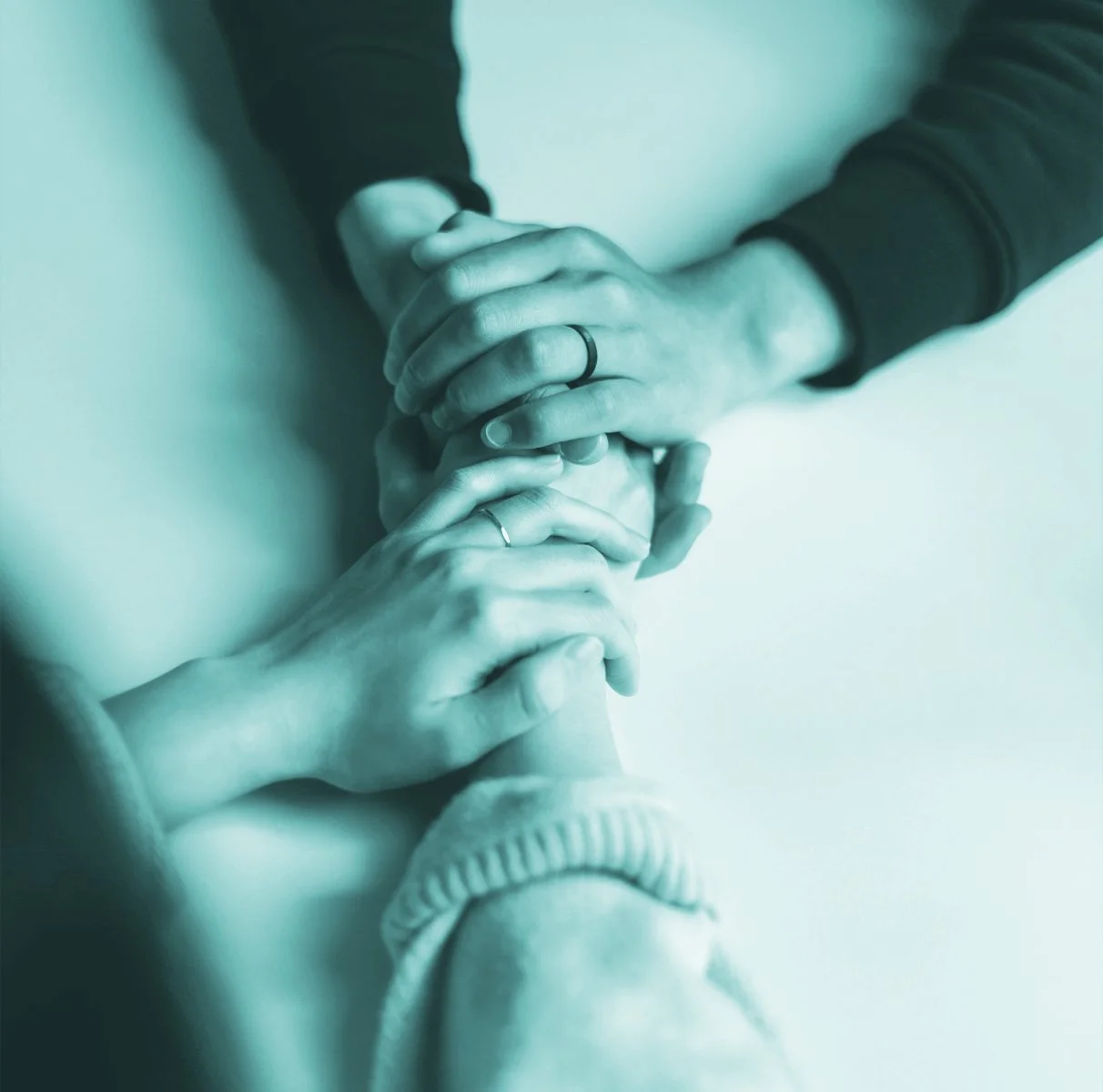 Kerry Christie leading a self-love workshop with participants seated on the floor