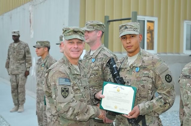 Jonathan Harris receiving an Army Achievement Medal for his work during his deployment to Afghanistan in 2013
