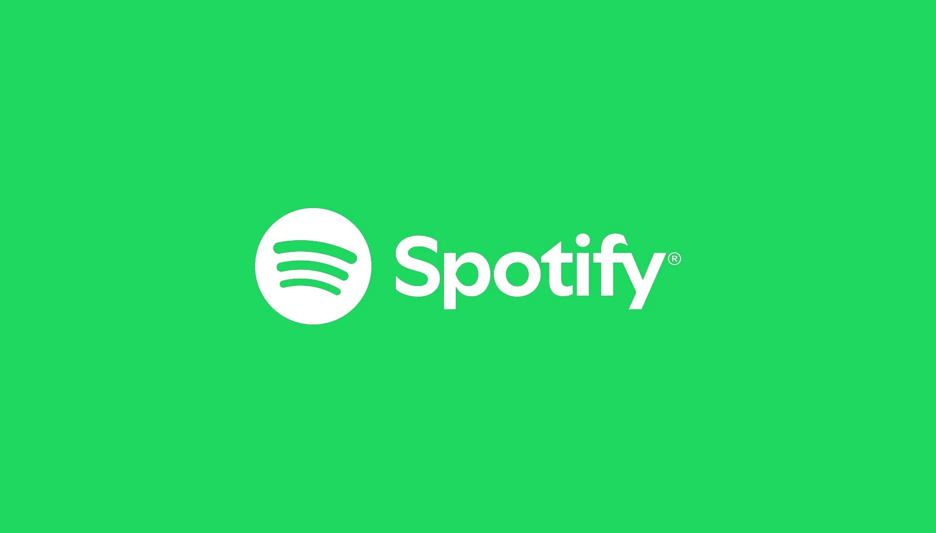 Green background with white Spotify logo and text reading 'Spotify'.
