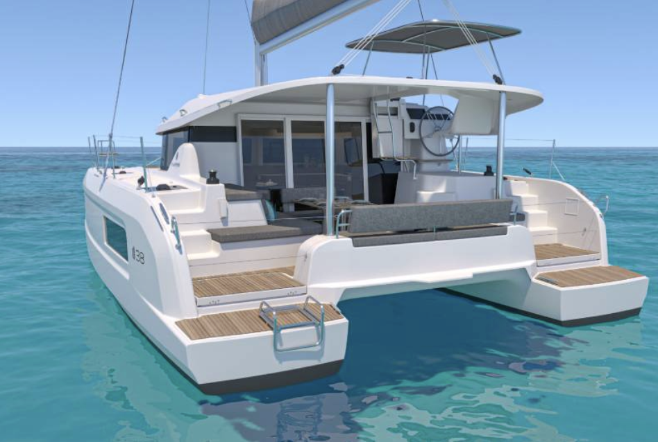 A modern white sailing yacht on the water with wooden decks and a shaded cockpit area.