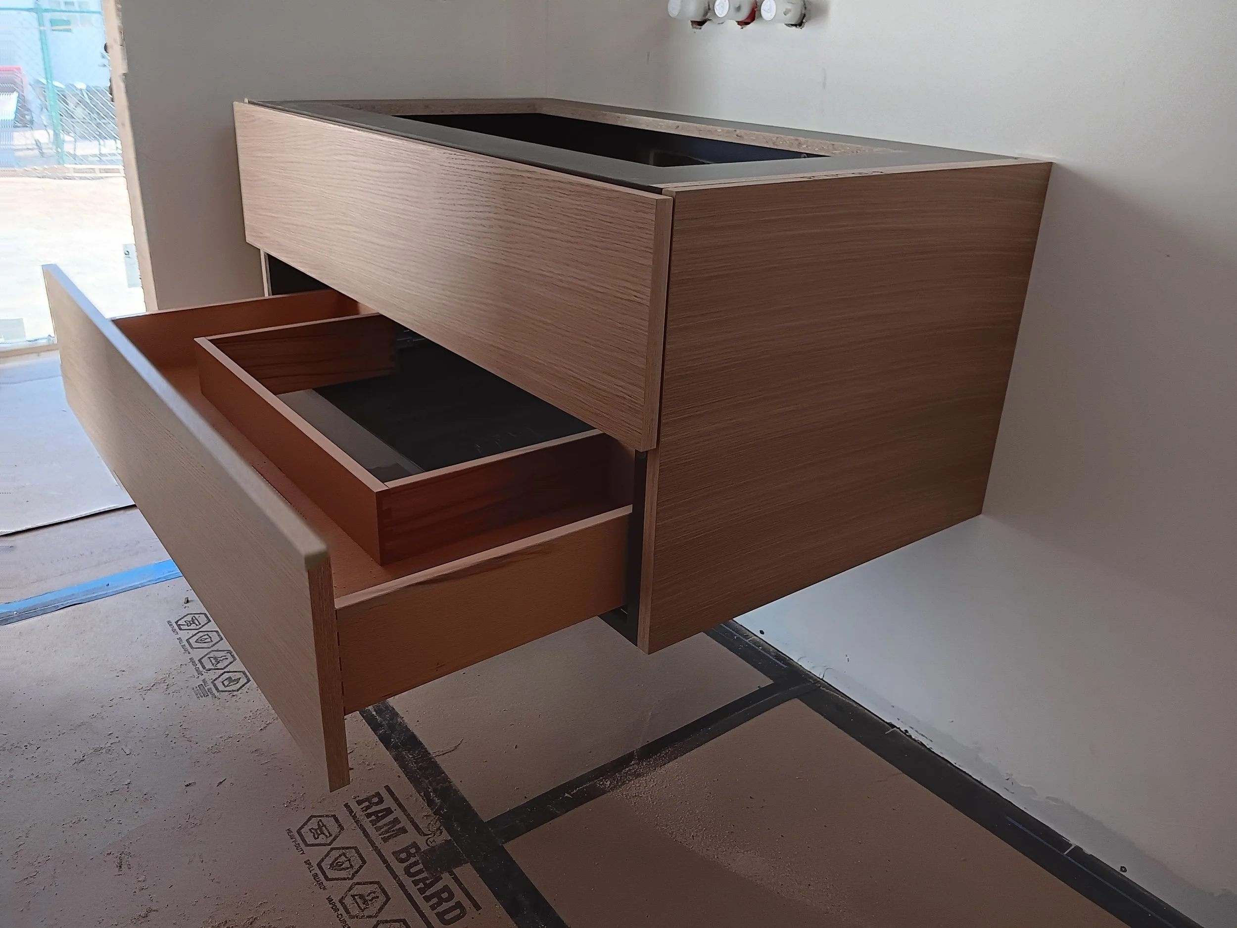 Live-edge wood vanity top in a modern rustic bathroom.