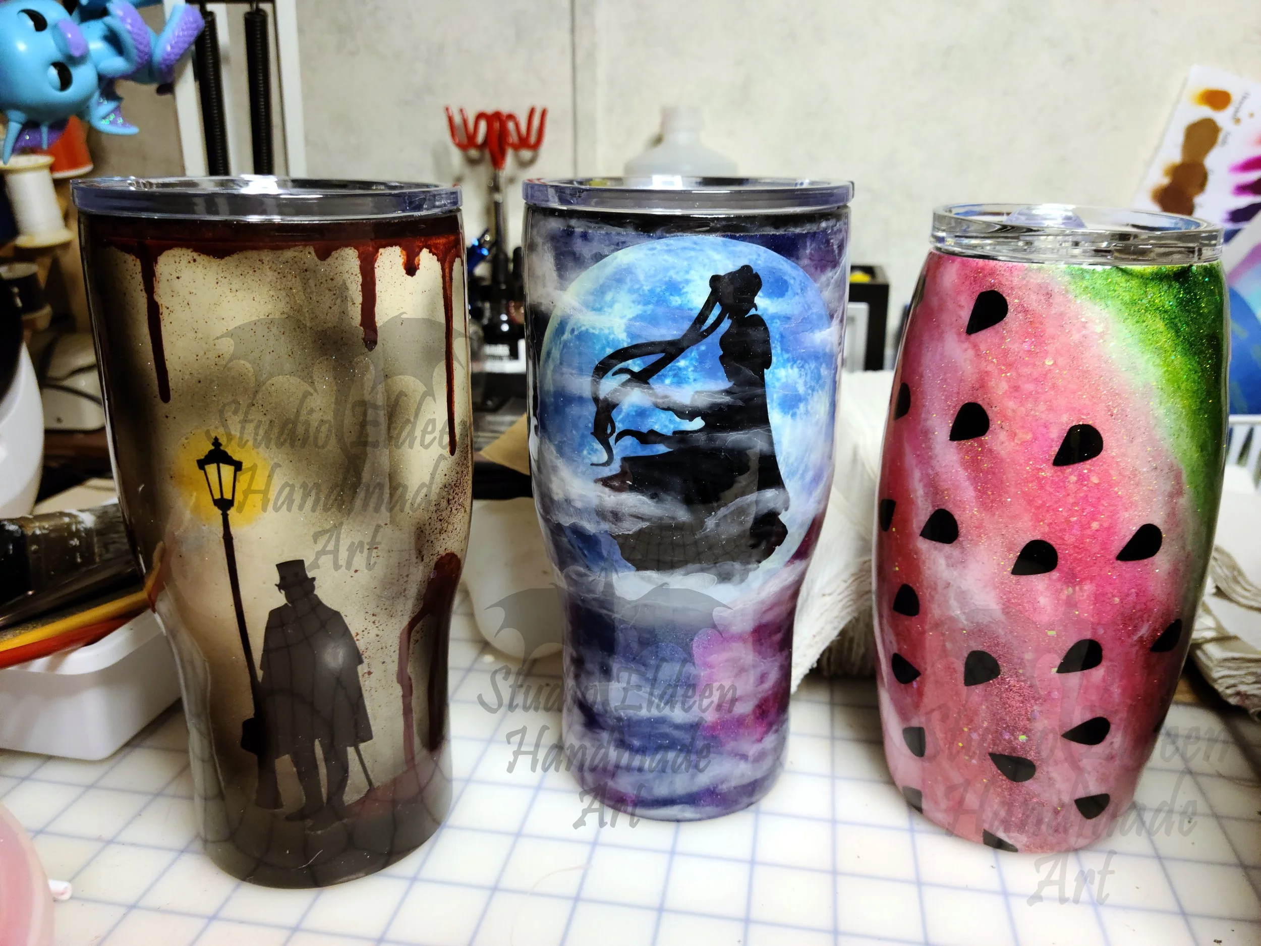 These three tumblers were orders from different customers that came in at about the same time.



My desk absolutely looked like a crime scene when I was done with the bloody drips on the Jack the Ripper tumbler.



I had fun figuring out how to make