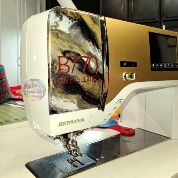 Mom accidentlaly put a big ugly scratch in the faceplate of her quilting machine and asked if I could do something to make it look nice. 

I marbled some matching colors in epoxy resin, used the Cricut to cut the numbers and letters from vinyl, then 