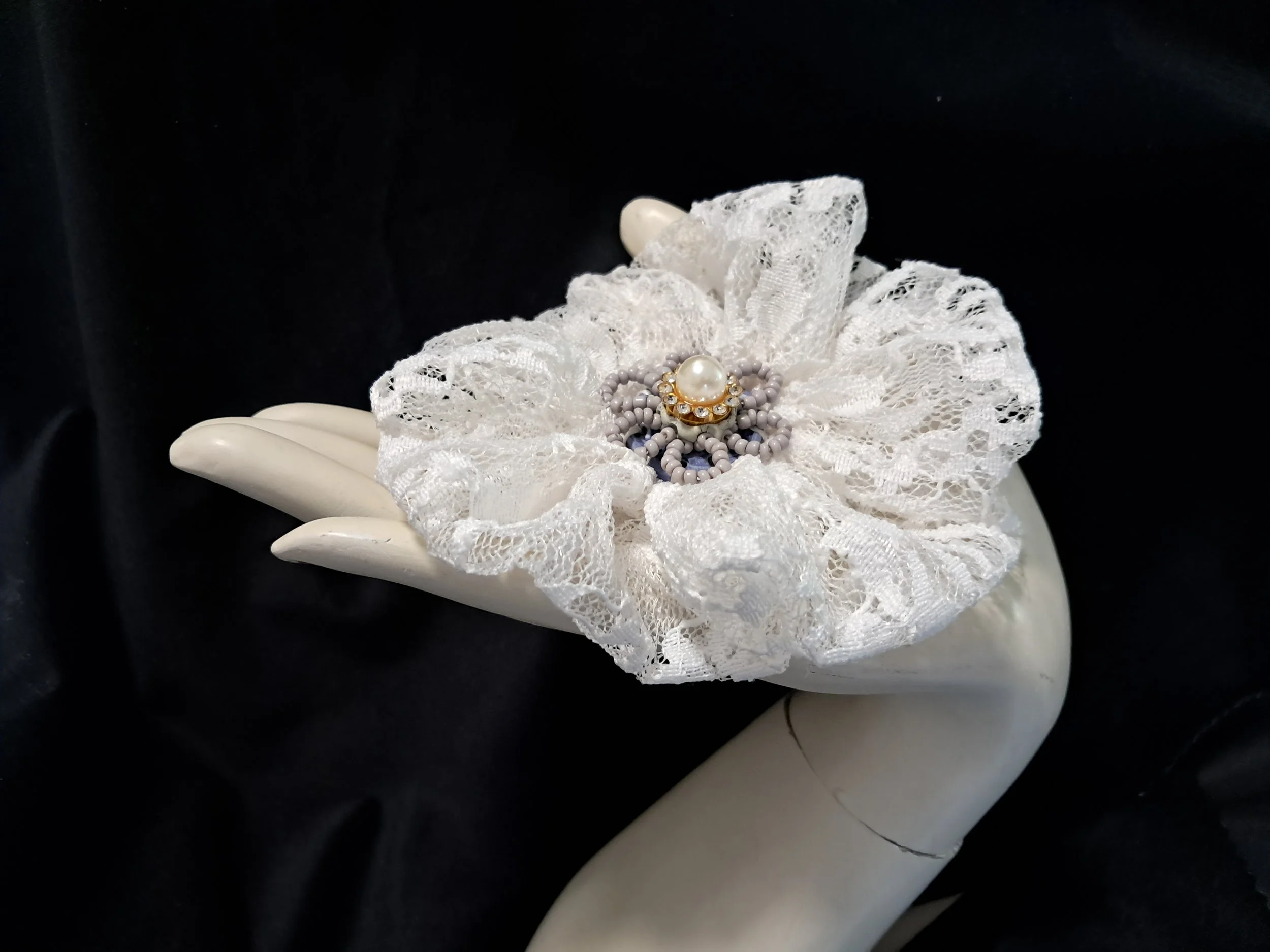 lace bead beooch hand.jpg