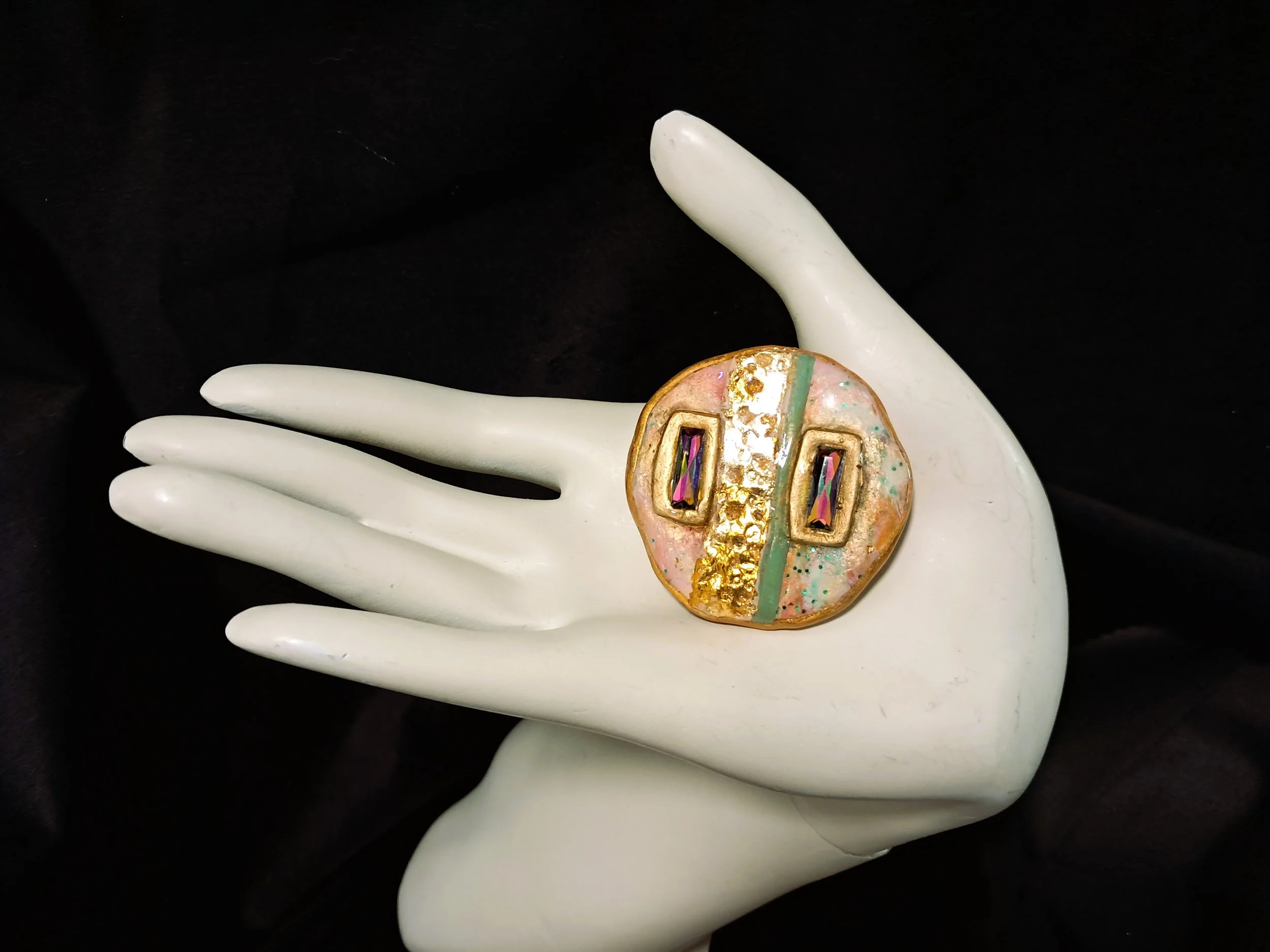 round brooch rectangle crystals hand.jpg