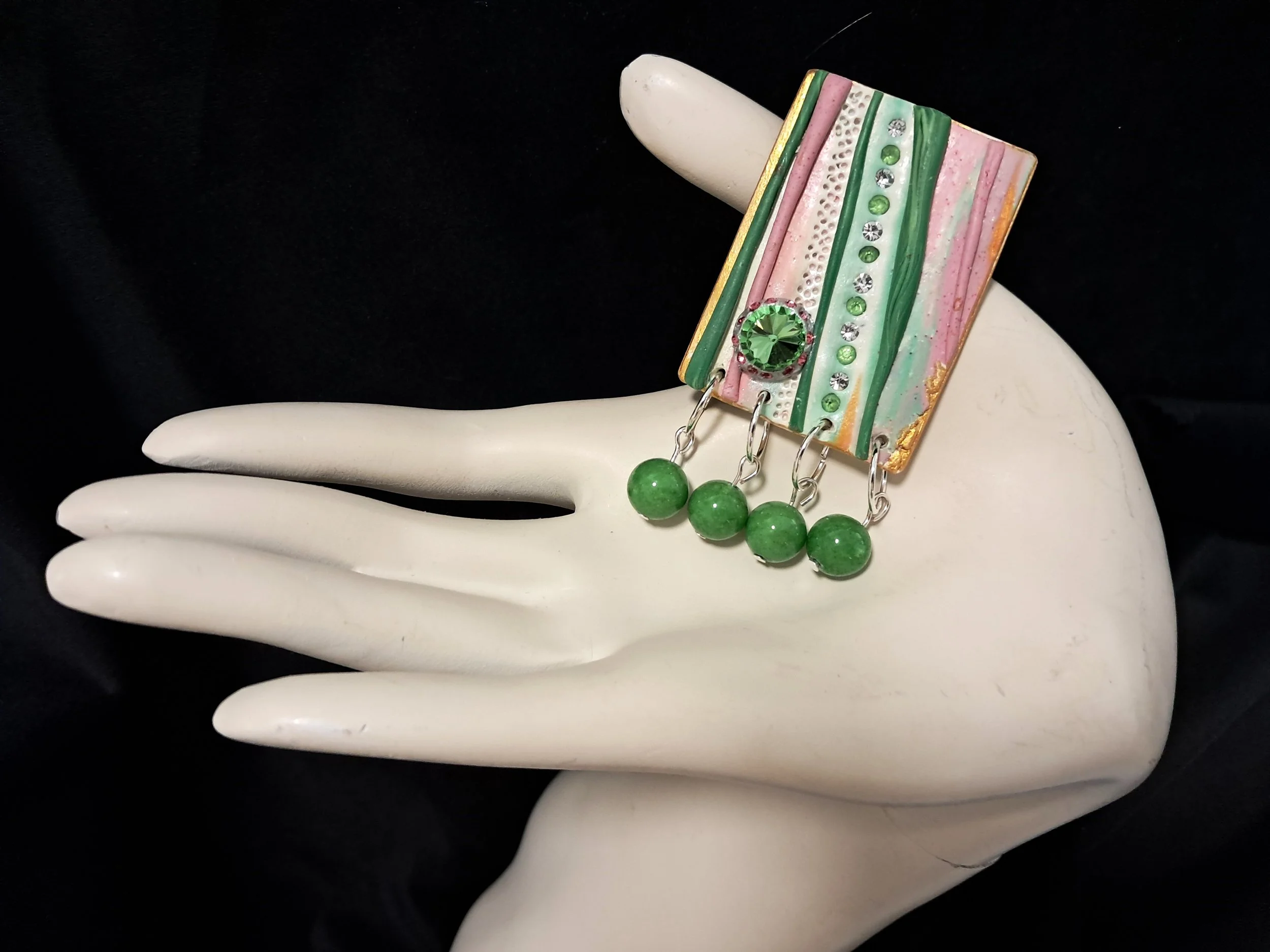 green swinger bead brooch hand.jpg